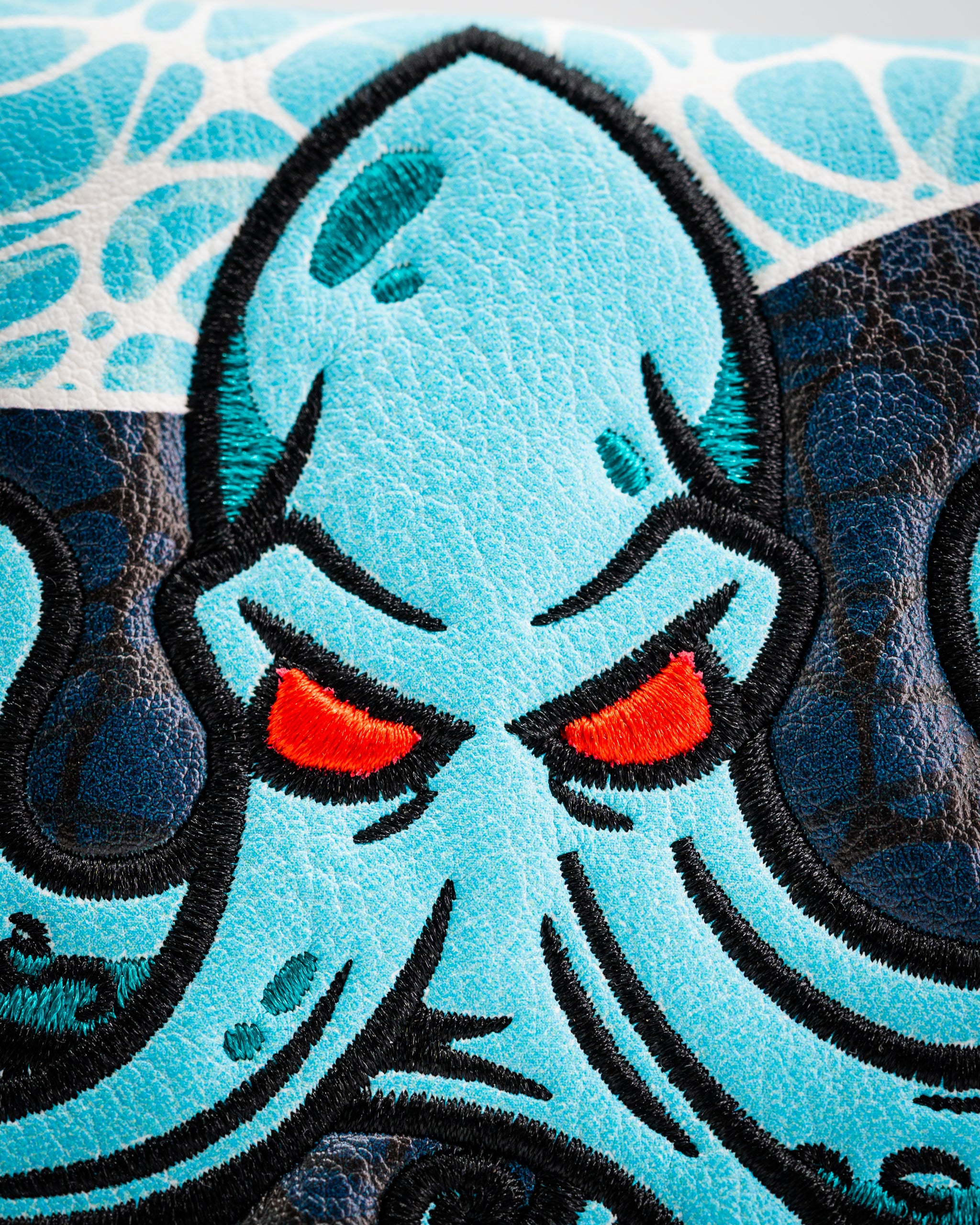 Bold Kraken mallet putter cover featuring a vibrant blue octopus design with striking red eyes and intricate detailing.