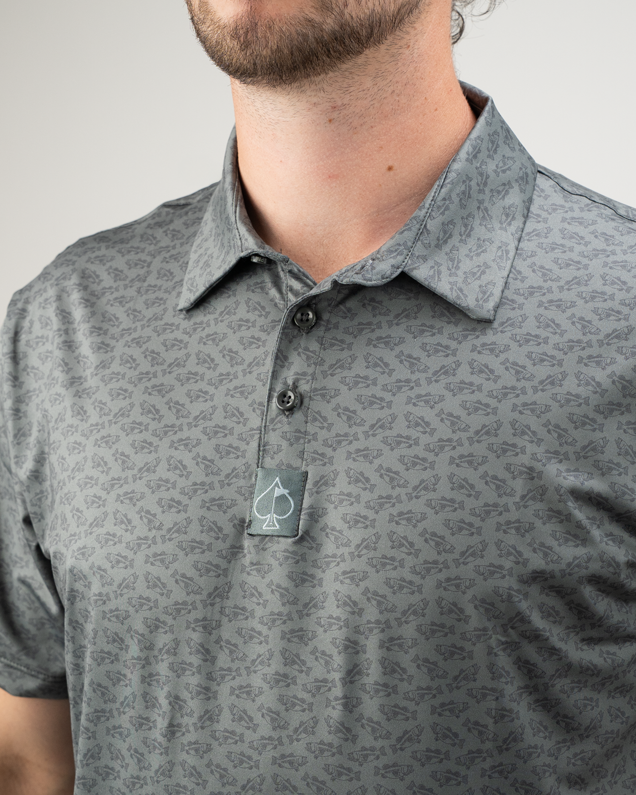 Men's golf polo shirt featuring a subtle pattern and a classic collar, ideal for stylish performance on the course.