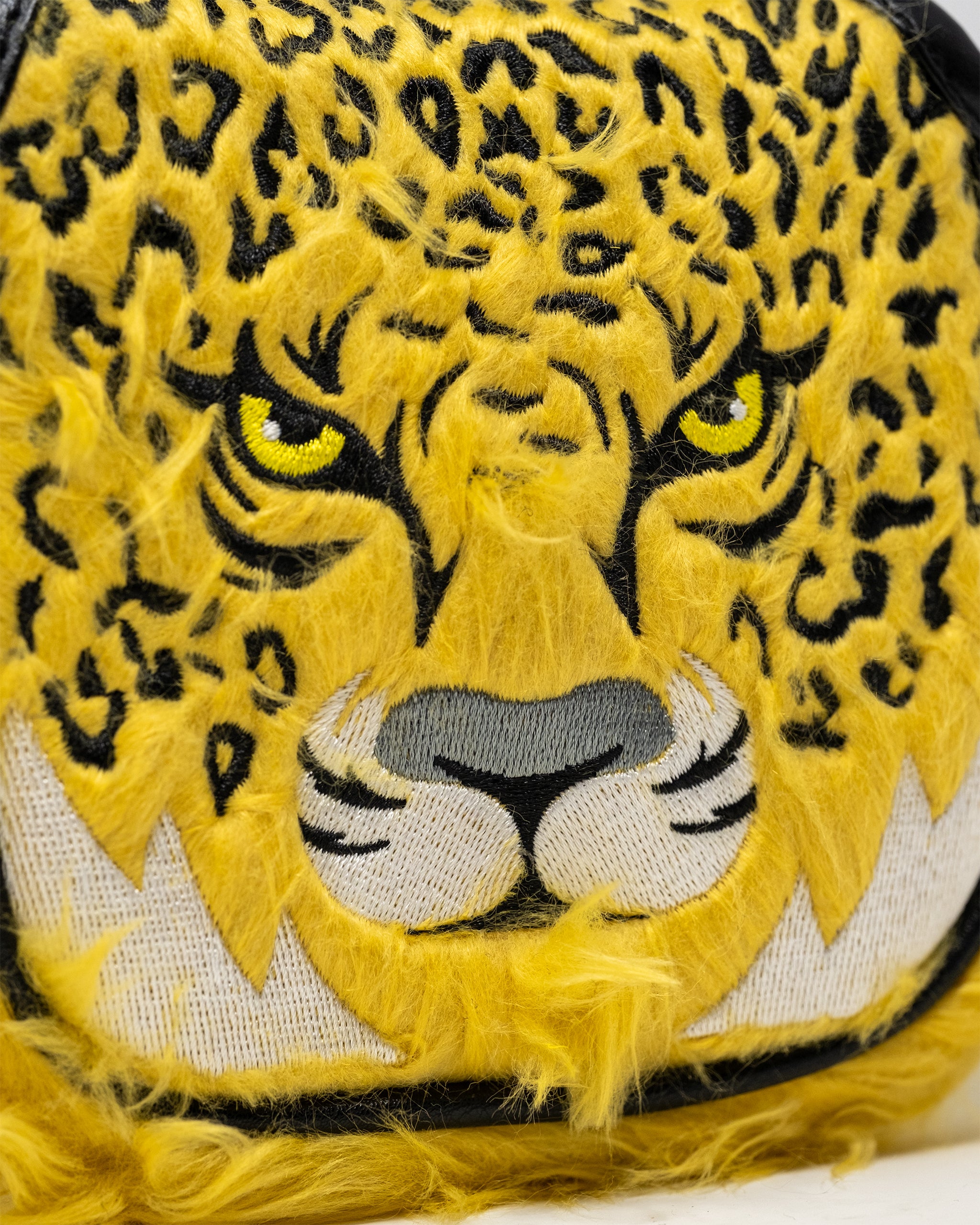 Leopard print mallet putter cover designed for golf clubs, featuring vibrant colors and a protective fit.