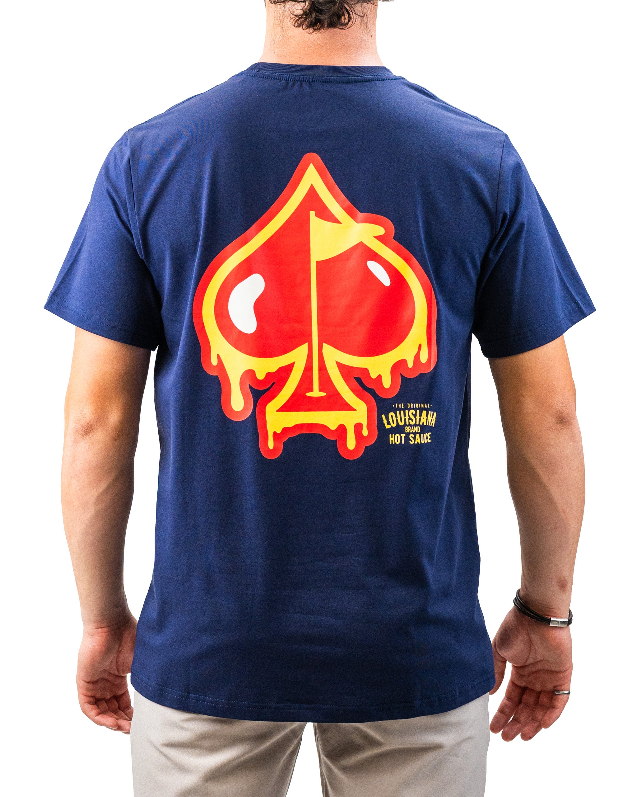 Bold navy T-shirt featuring a large, colorful Louisiana hot sauce skull graphic with yellow and red accents.