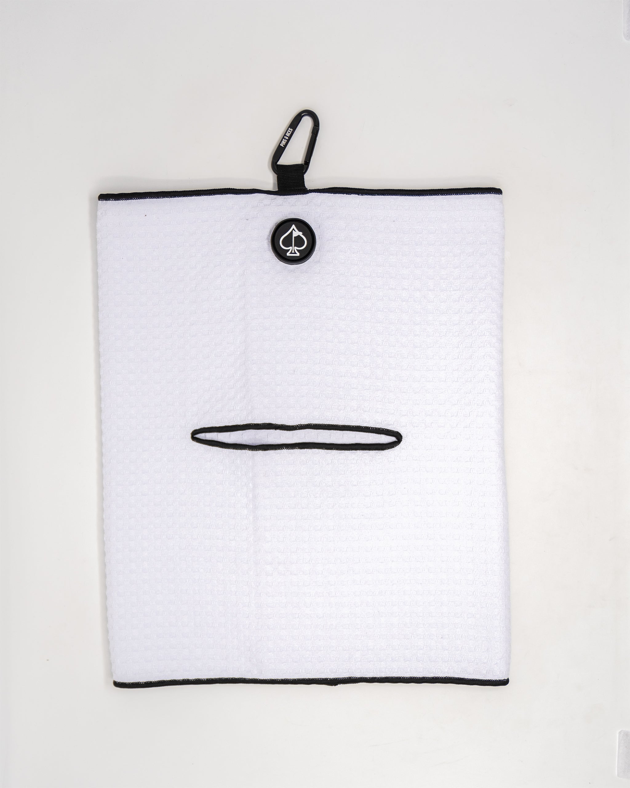White magnetic towel with a sleek design, featuring a strong magnetic backing for easy attachment and storage.