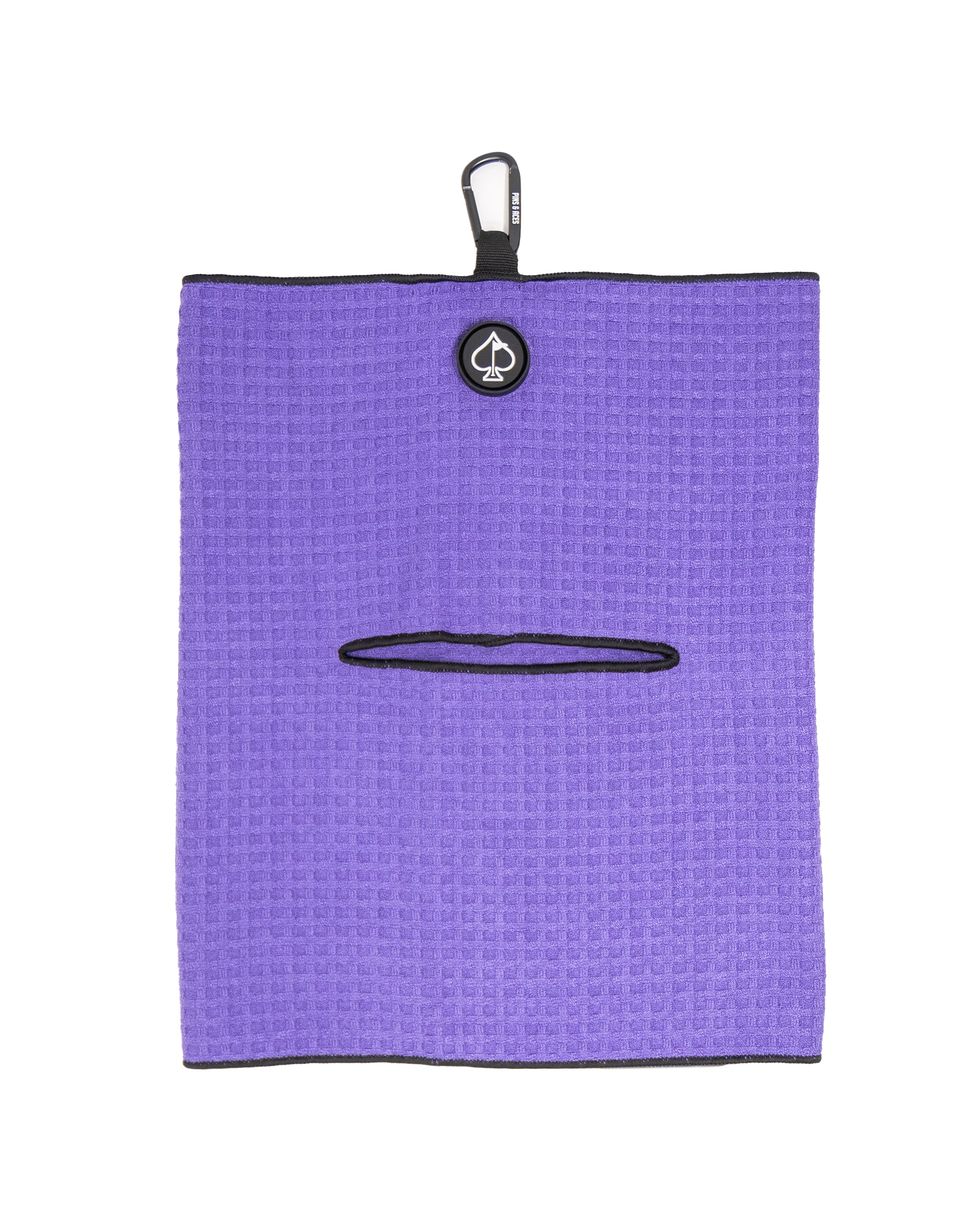 Bold purple golf towel with black trim, features a black logo, a small pocket, and a carabiner clip for attaching accessor...