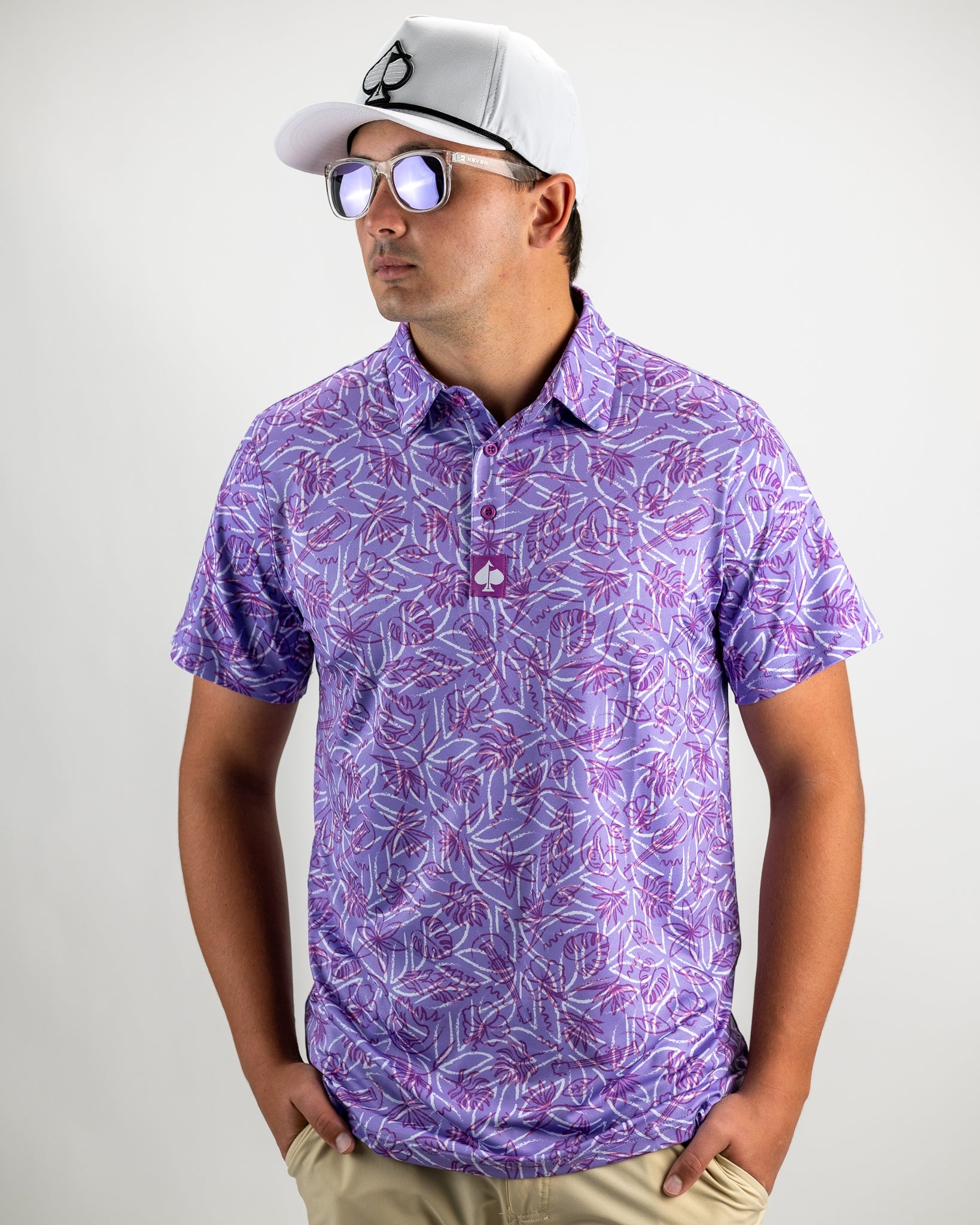 Margaritaville 5 O'Clock Sunset polo shirt in vibrant sunset colors with a tropical design.