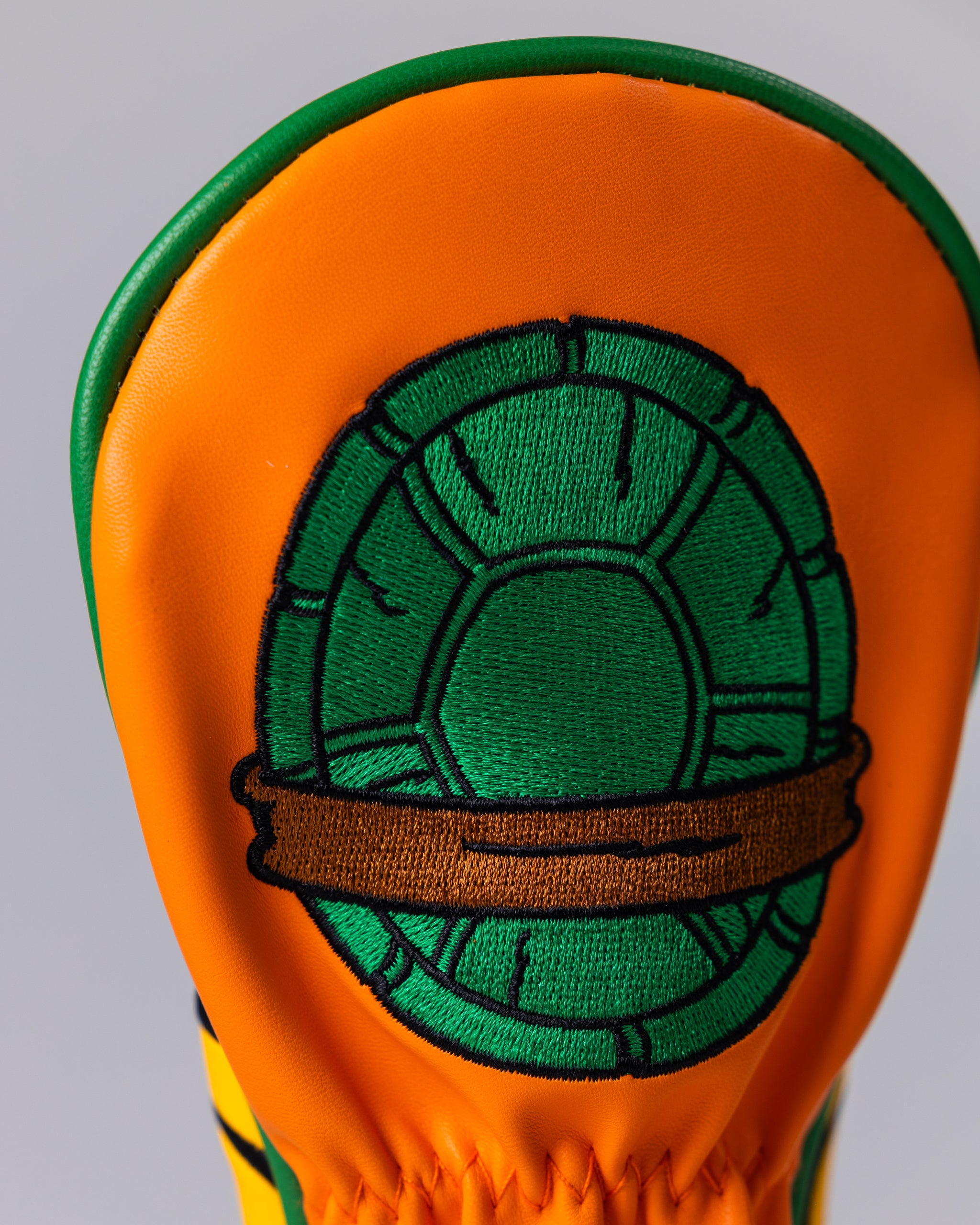 TMNT Michelangelo Hybrid Cover featuring vibrant artwork of Michelangelo, showcasing his iconic orange bandana and nunchaku against a dynamic background.