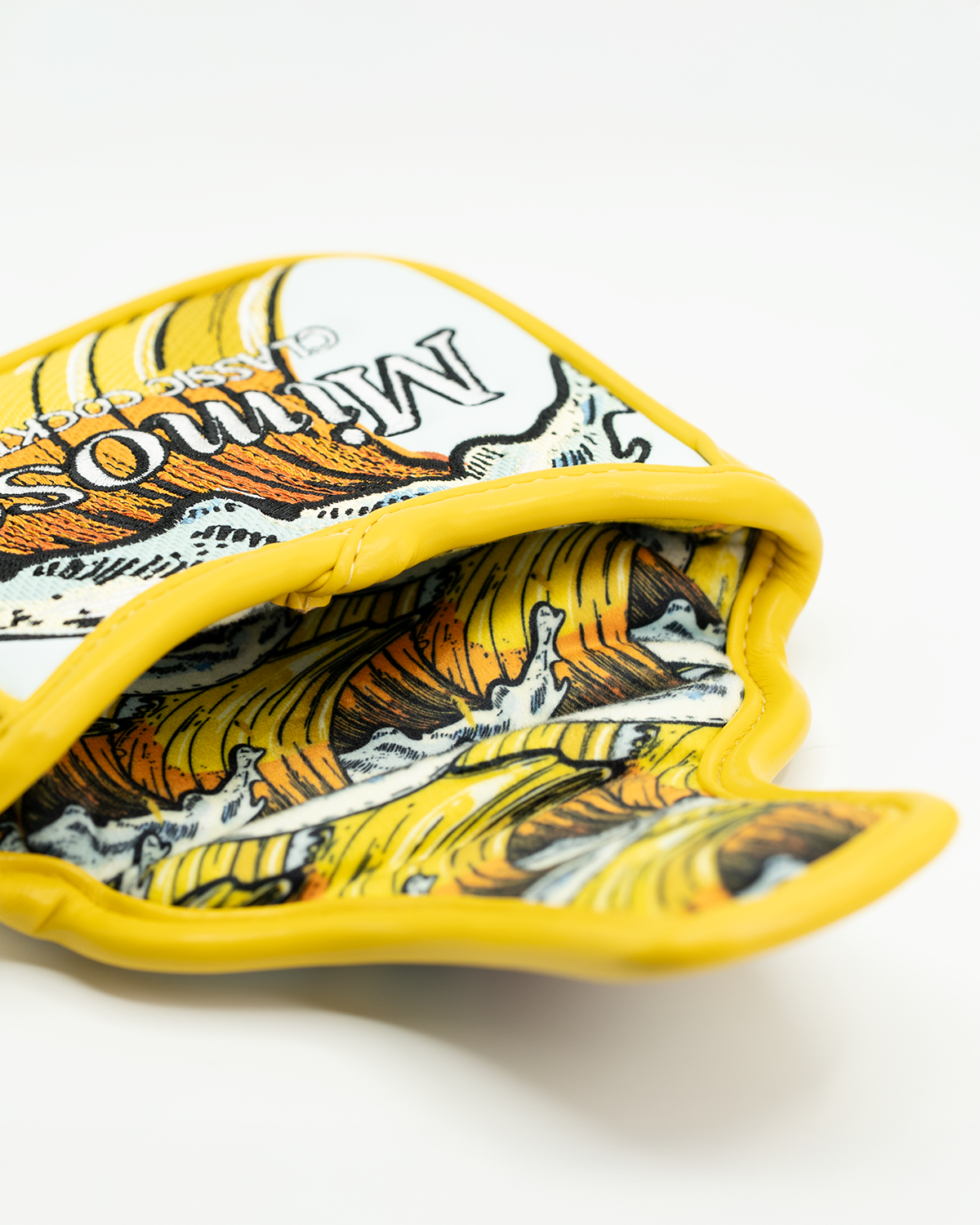 Mimosa mallet putter cover featuring a vibrant yellow design with a detailed graphic and soft interior lining.