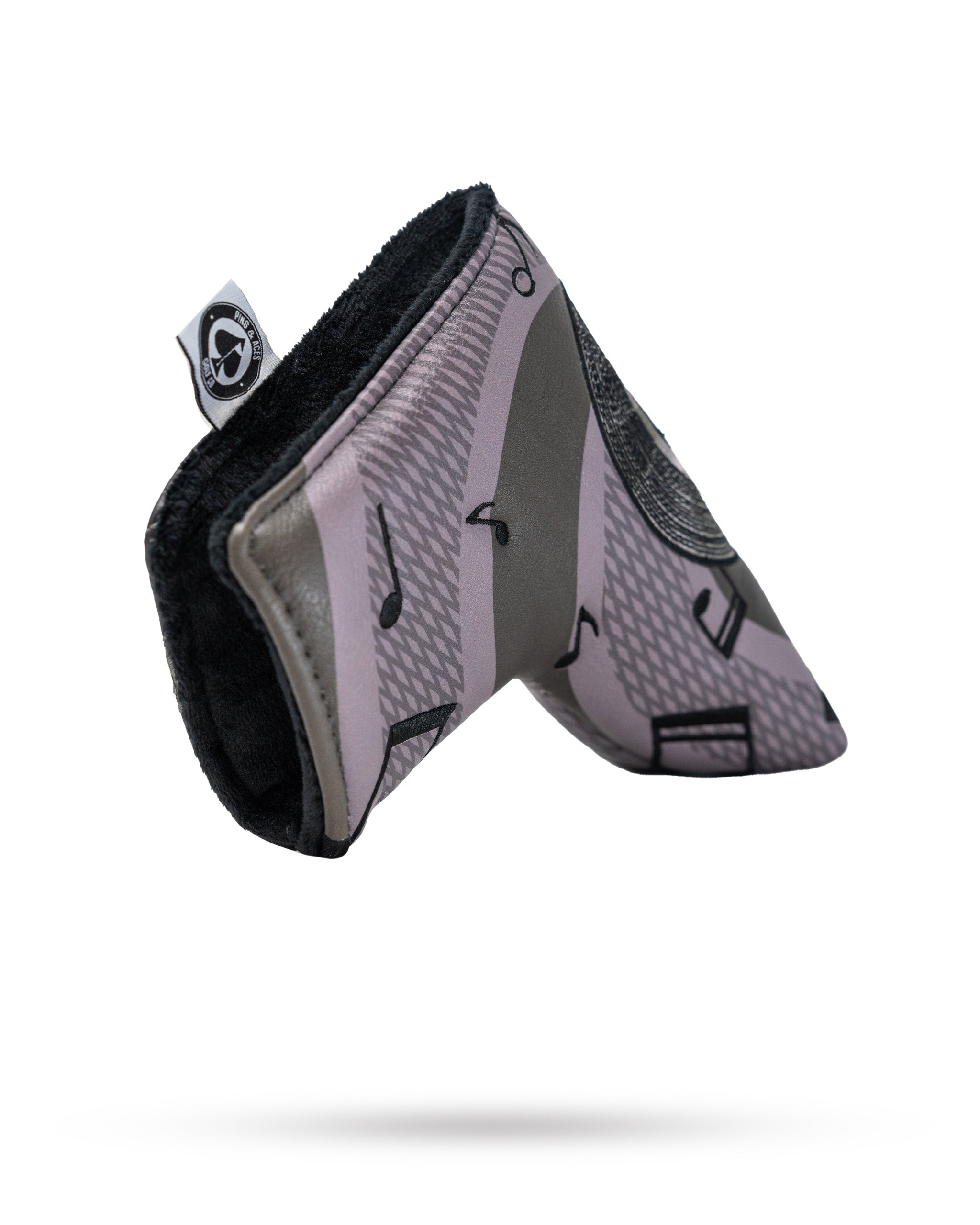 "Music City Blade Putter Cover featuring a vibrant design, ideal for protecting golf putters, with bold colors and a stylish, sleek fit."