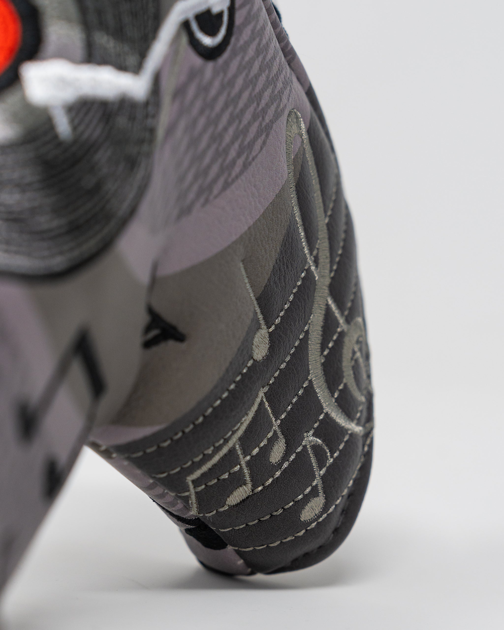 Music City Blade Putter Cover featuring a vibrant design with musical elements, ideal for golf enthusiasts.