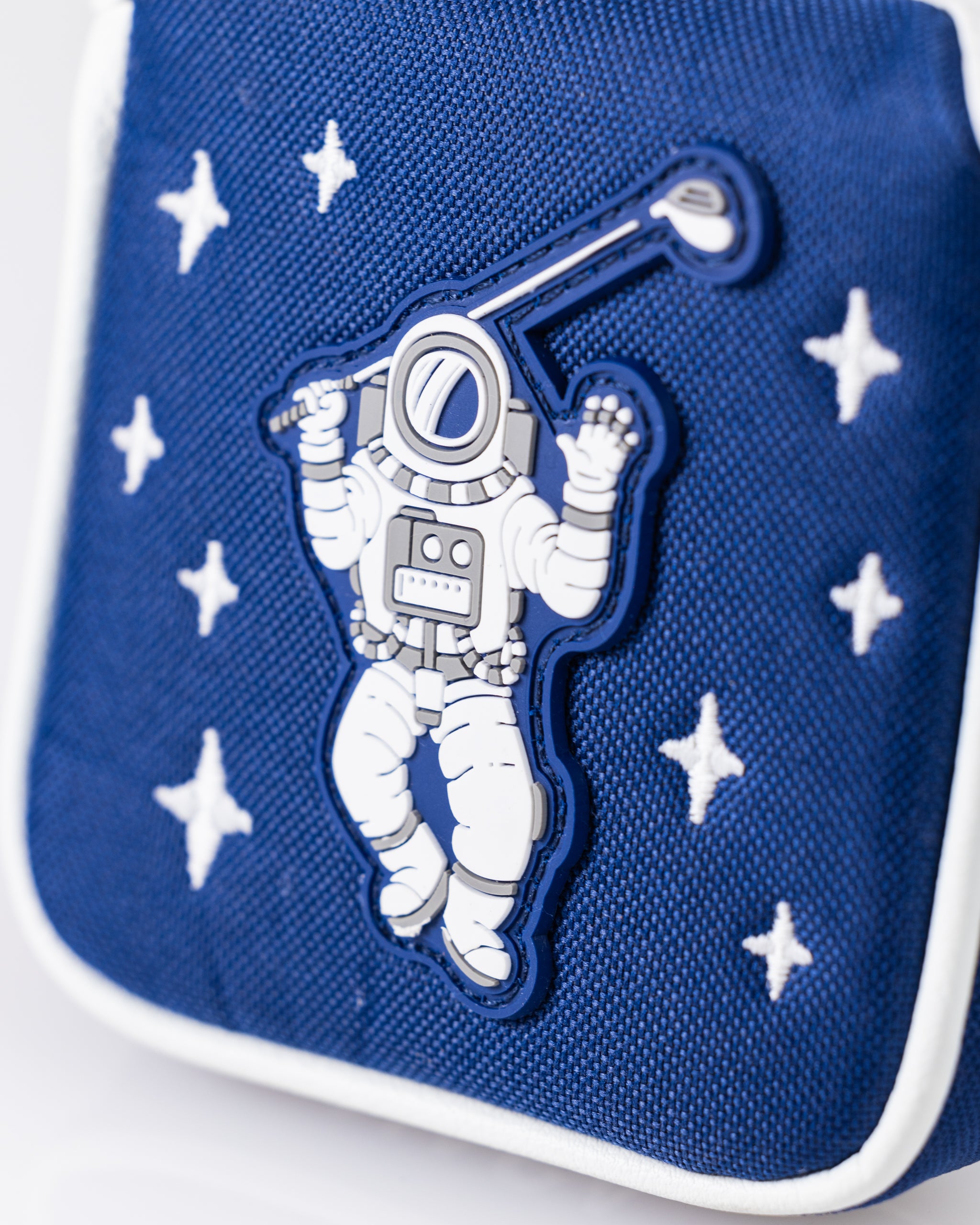 NASA-themed mallet putter cover featuring a space walk design, showcasing vibrant colors and detailed astronaut imagery on a sleek black background.