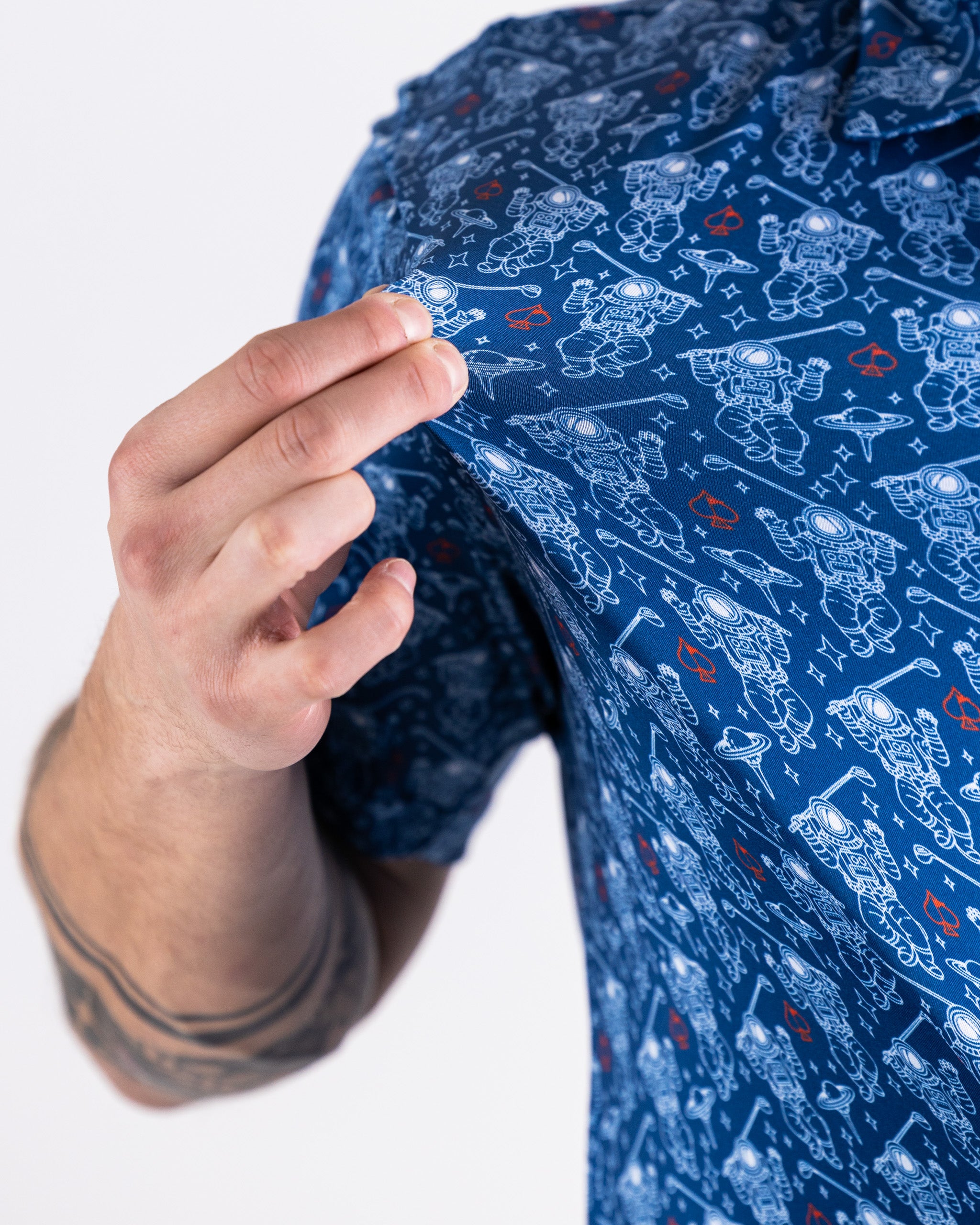 "NASA Space Walker blue polo shirt featuring the NASA logo and astronaut graphic."