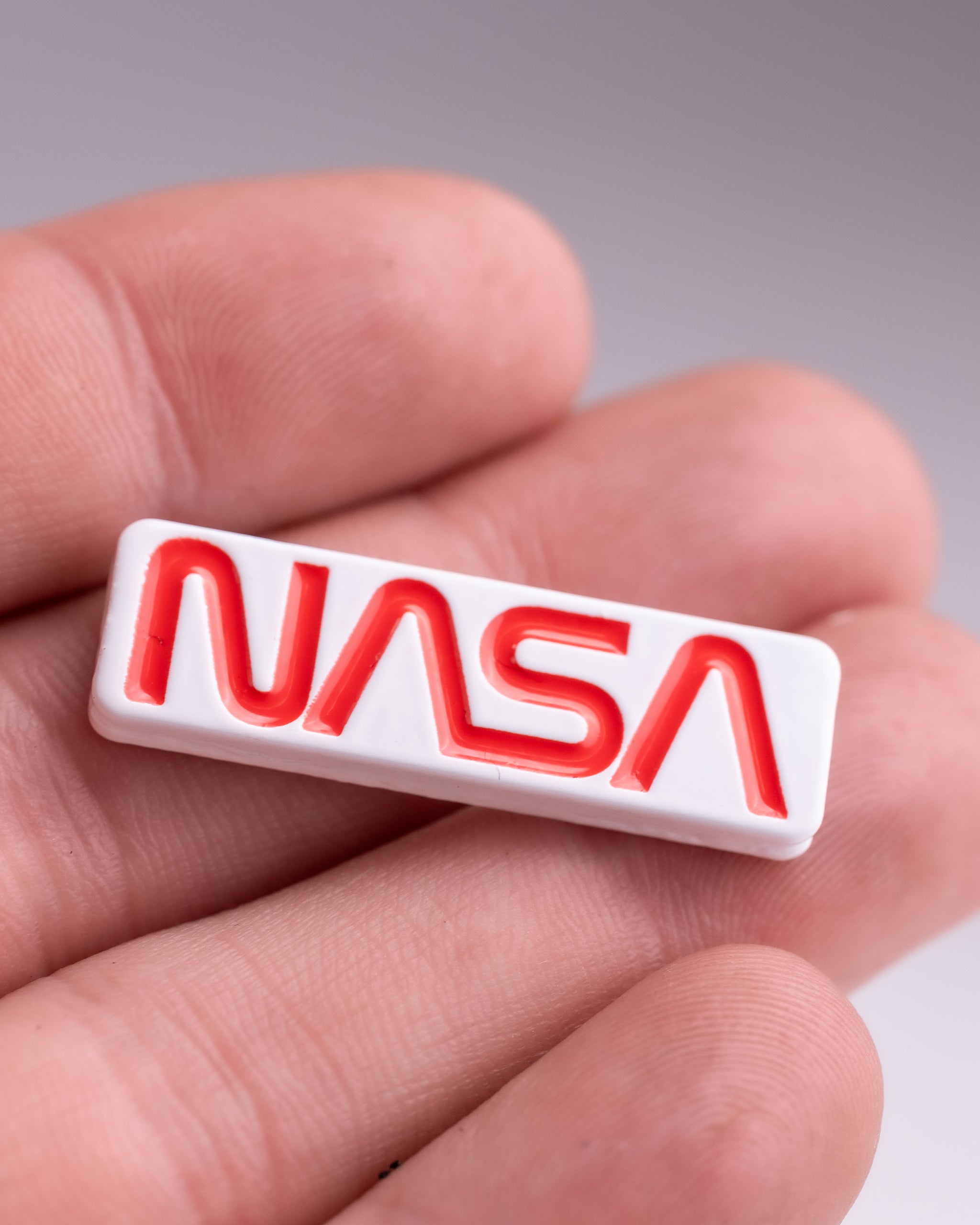 NASA "Worm" Ball Marker featuring a bold red and blue design with the iconic NASA logo.