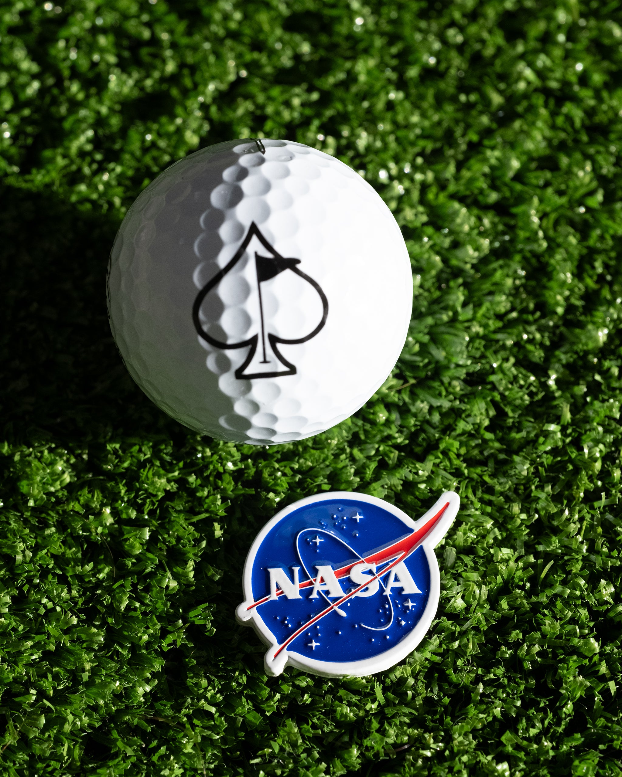 NASA "Meatball" ball marker featuring the iconic logo in vibrant colors, perfect for golf enthusiasts and space fans.