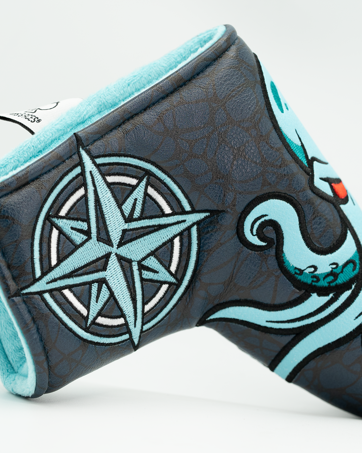 Kraken blade putter cover featuring a vibrant octopus design and a compass, designed for bold golf style.