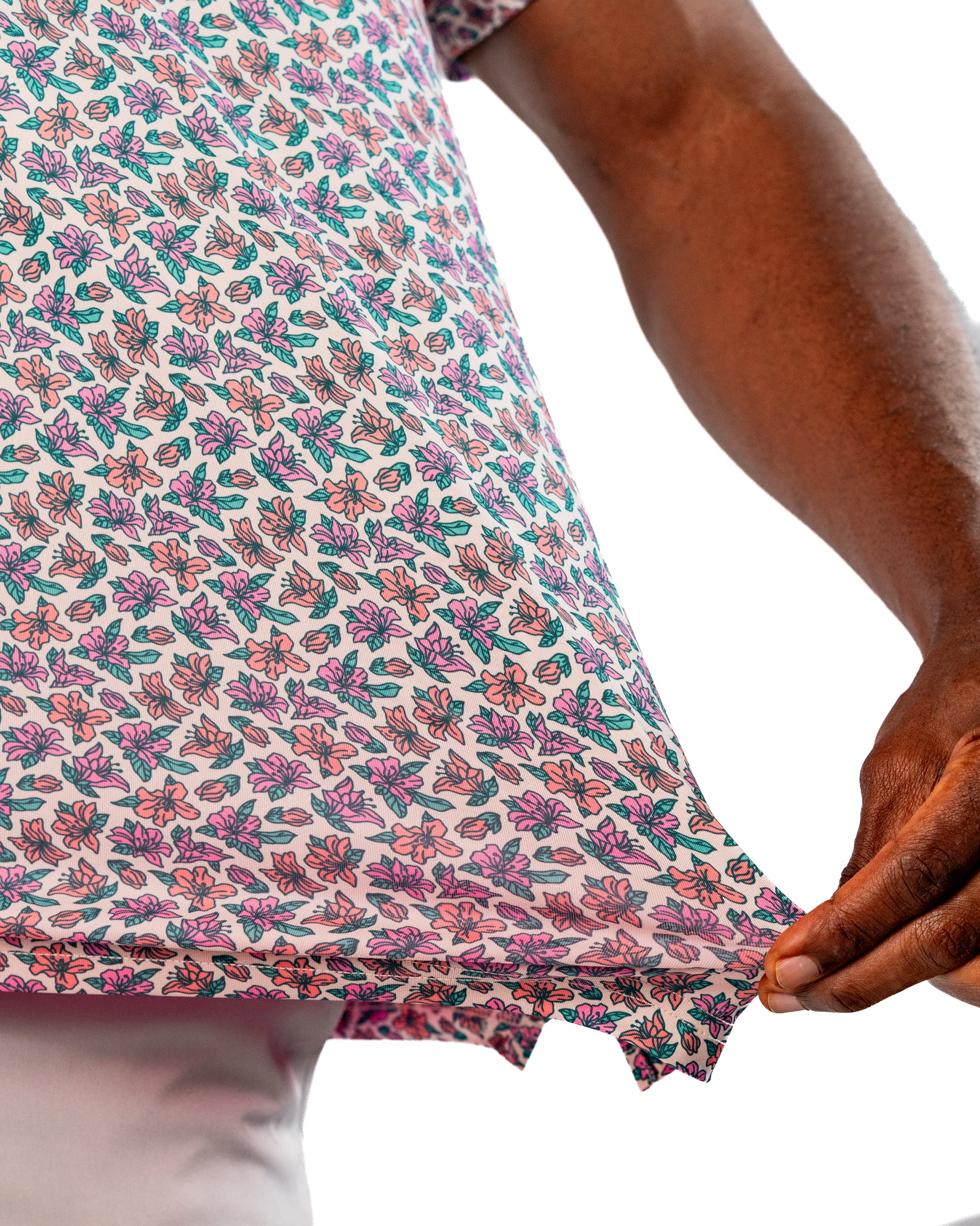Light Azalea golf shirt featuring a vibrant floral pattern in pink and green, showcasing its soft fabric and stylish design.