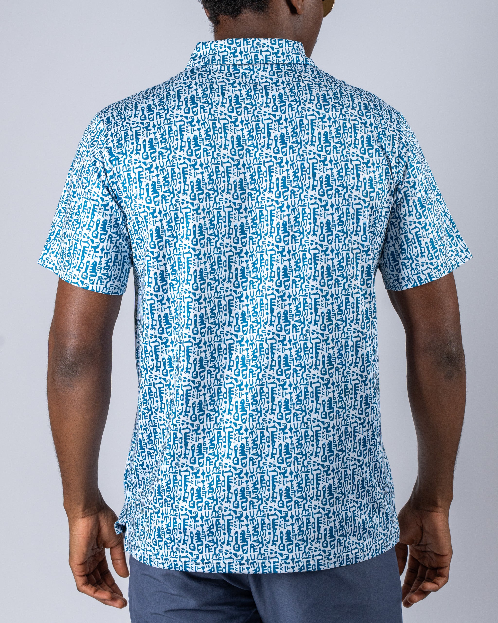 Men's Maze Craze golf shirt featuring a bold blue and white abstract pattern, designed for a standout look on the course.