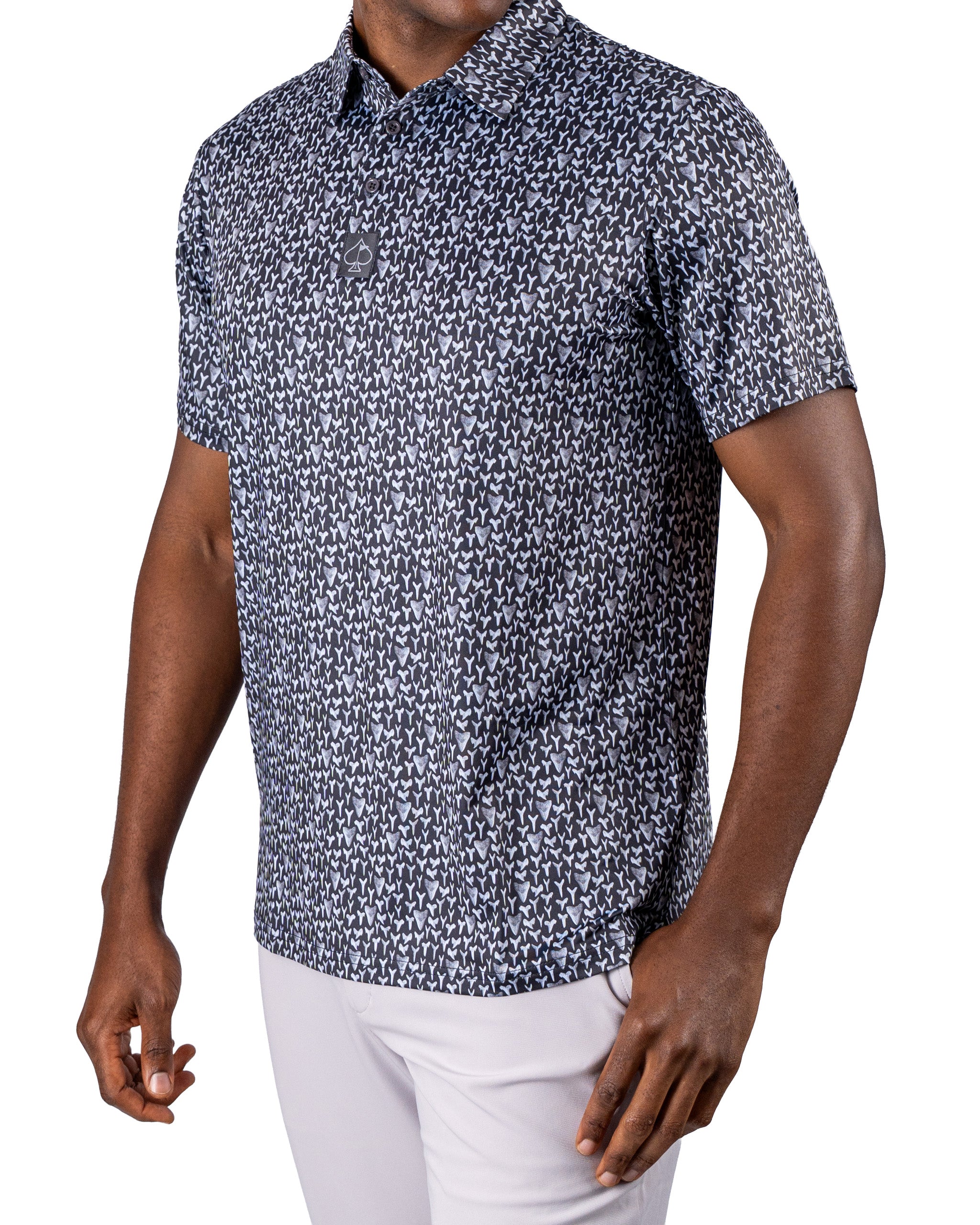 Men's short-sleeve golf shirt featuring a bold shark tooth pattern in navy and white, designed for stylish performance on the course.