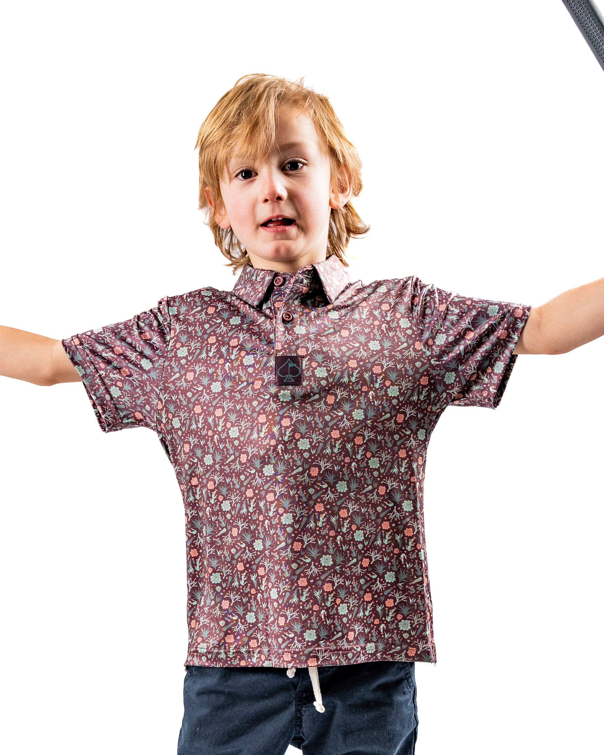 Youth Desert Sage golf shirt featuring a playful pattern, designed for young golfers who want to stand out on the course.