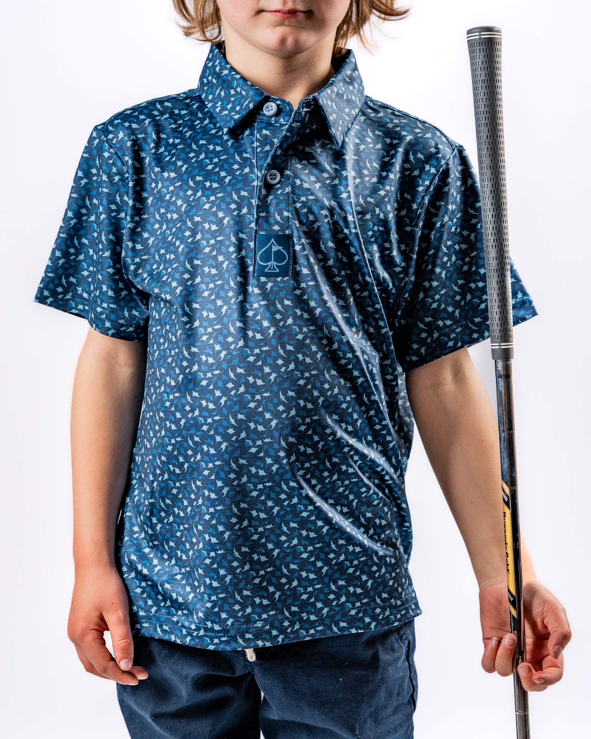 Youth Manta Ray golf shirt in navy with a playful pattern, perfect for young golfers looking to stand out on the course.