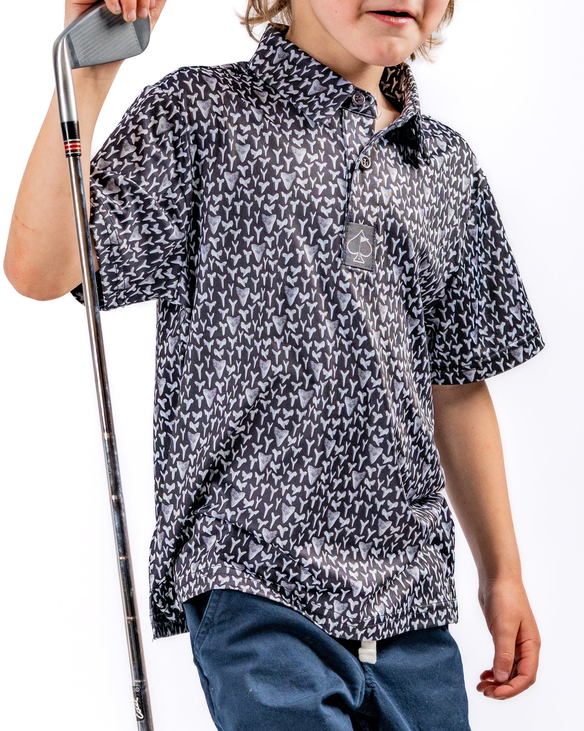 Youth Shark Tooth golf shirt featuring a playful shark tooth pattern, perfect for young golfers looking to stand out on the course.
