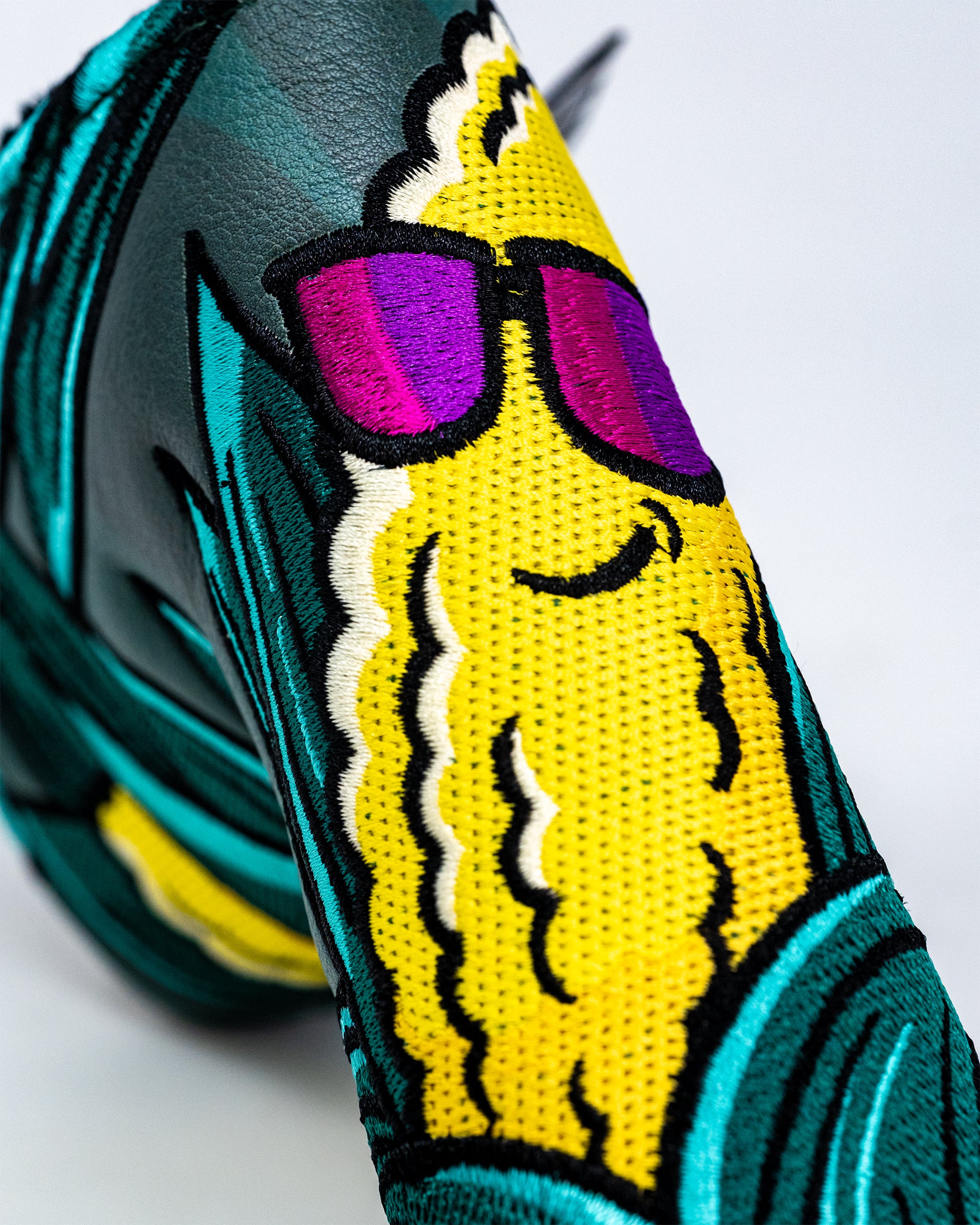 Corn Star Blade Putter Cover featuring a vibrant corn design with a plush, padded exterior for protection and style.