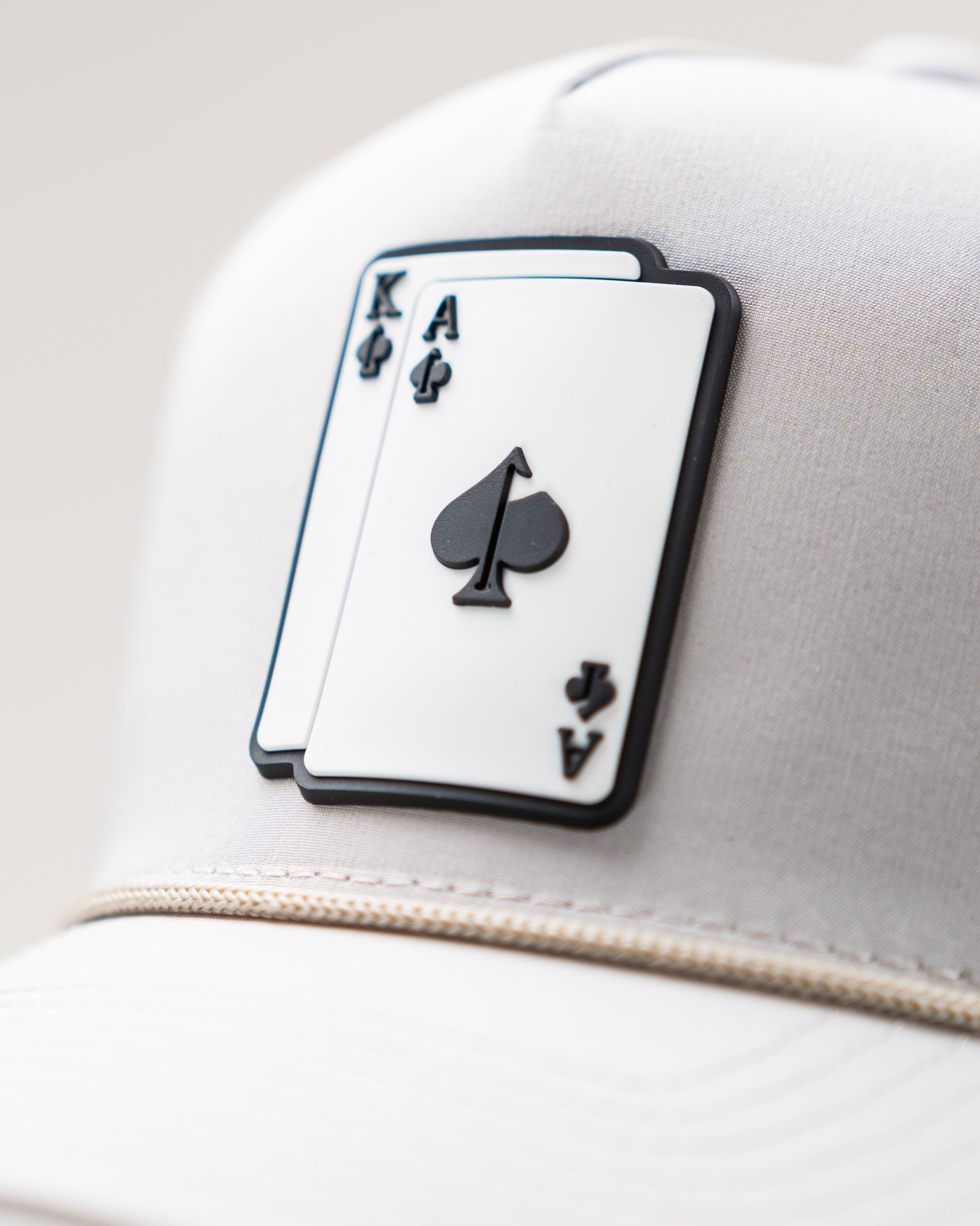 Perforated Rope Hat in Bone color by AK, featuring a stylish design and breathable fabric.