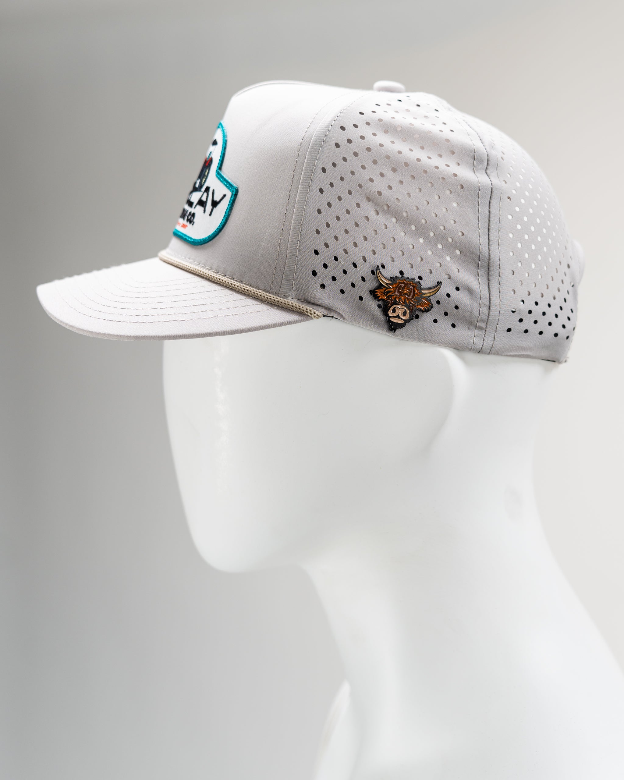 Perforated rope hat in bone color by Parlay Building Co. with a stylish design and adjustable fit.