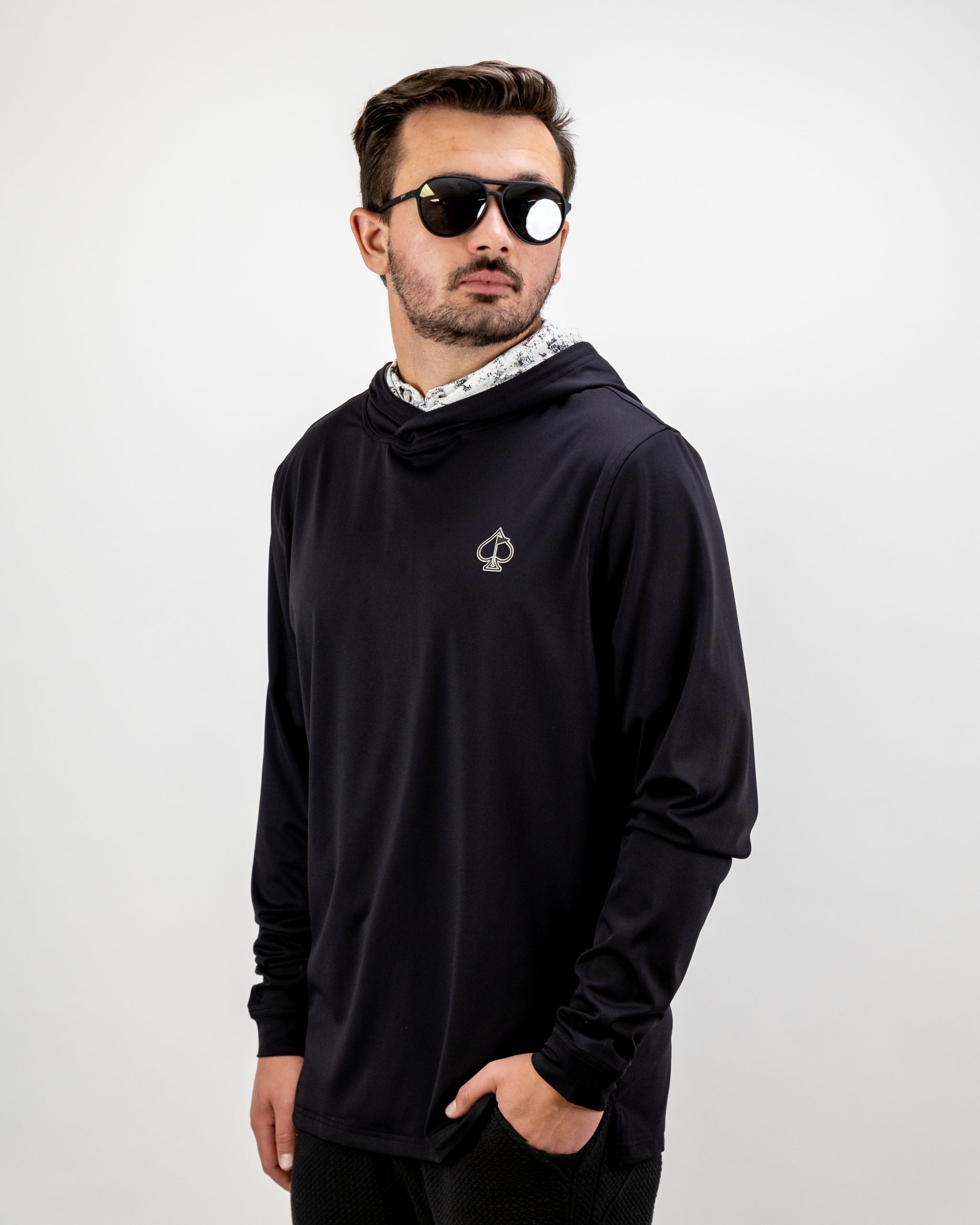 Men's performance golf hoodie in white with a sleek design, perfect for stylish comfort on the golf course.