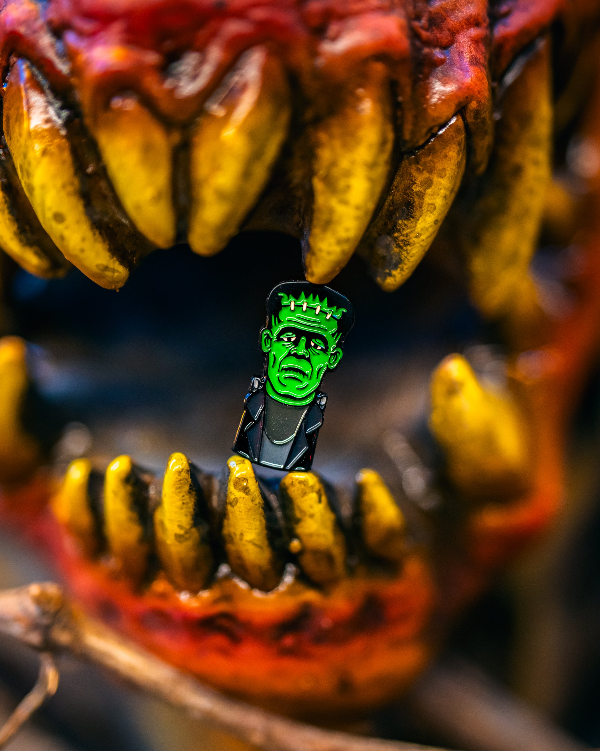 Frankenstein-themed golf ball marker featuring a cartoonish green monster face with stitched details and a playful expression.