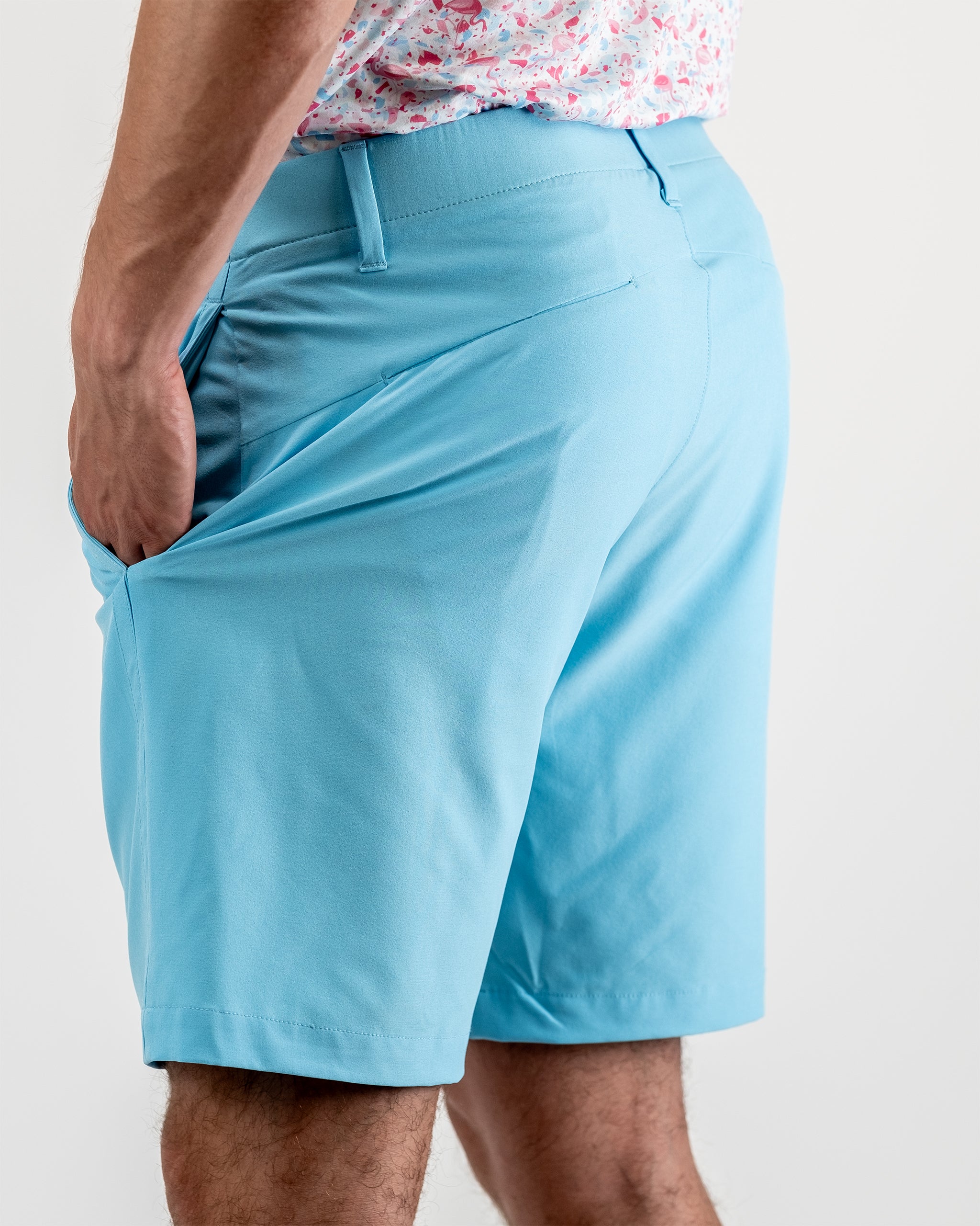 Sky blue performance shorts displayed on a flat surface, featuring a lightweight fabric and elastic waistband.