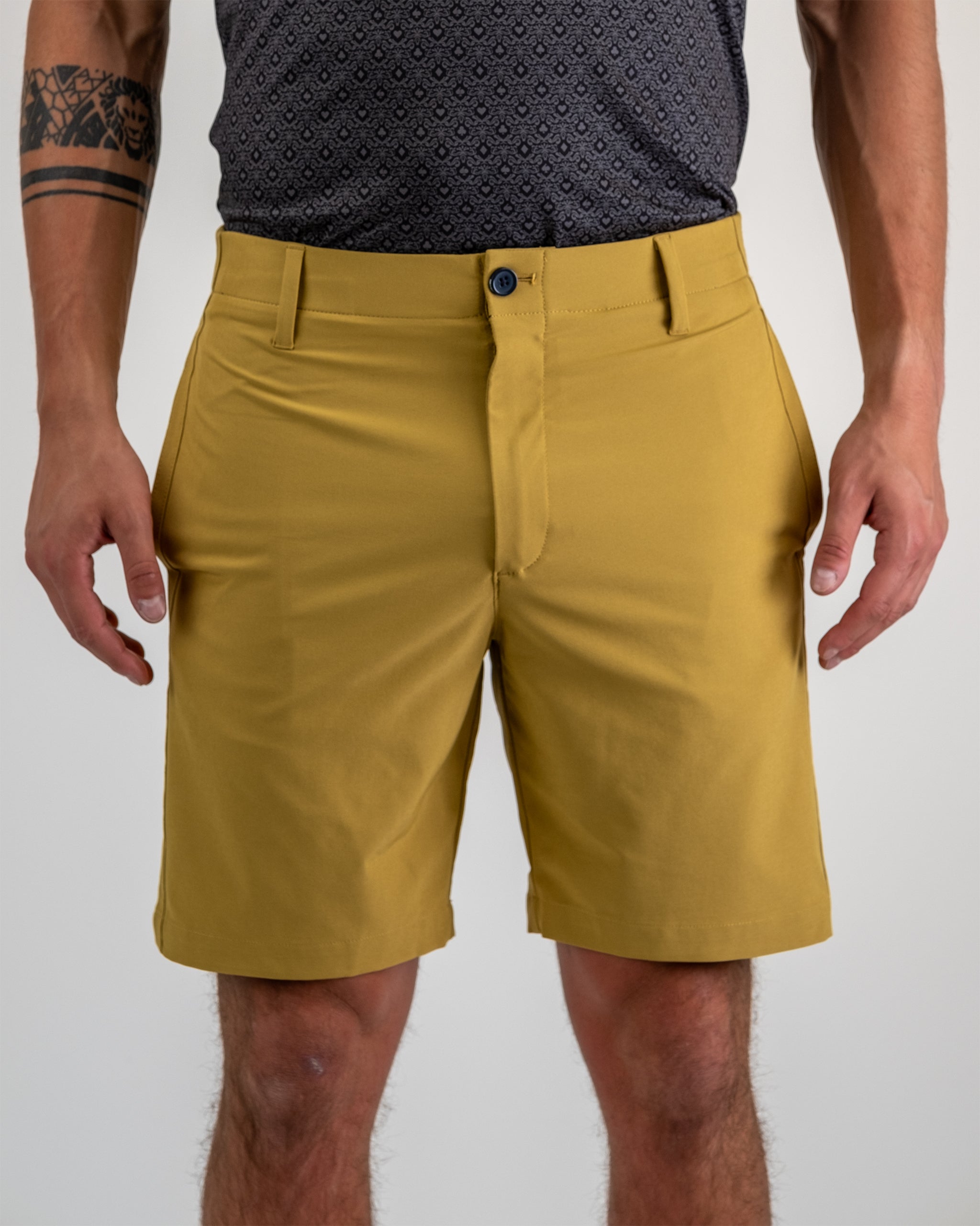 Performance shorts in Dune color with a lightweight, breathable fabric and an elastic waistband for comfort.