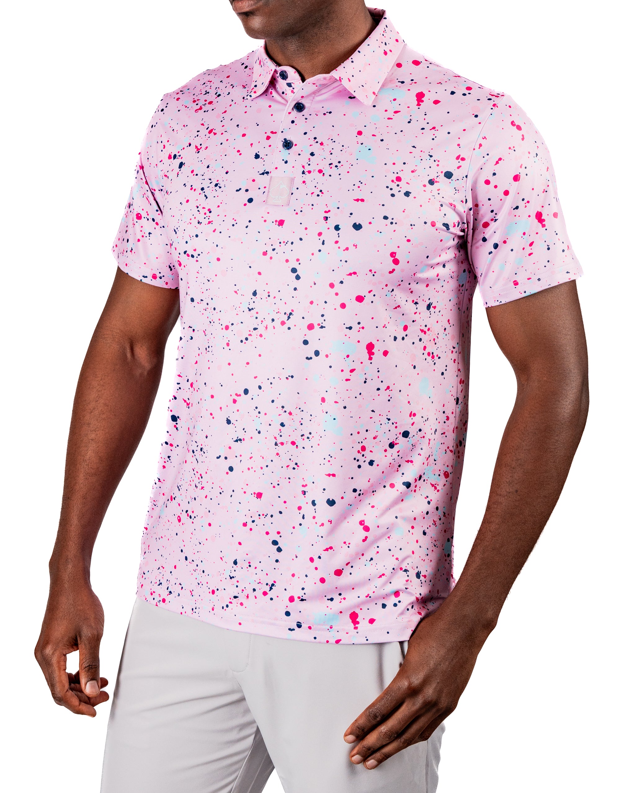 Men's pink splatter golf polo featuring vibrant paint splashes, perfect for making a bold statement on the course.