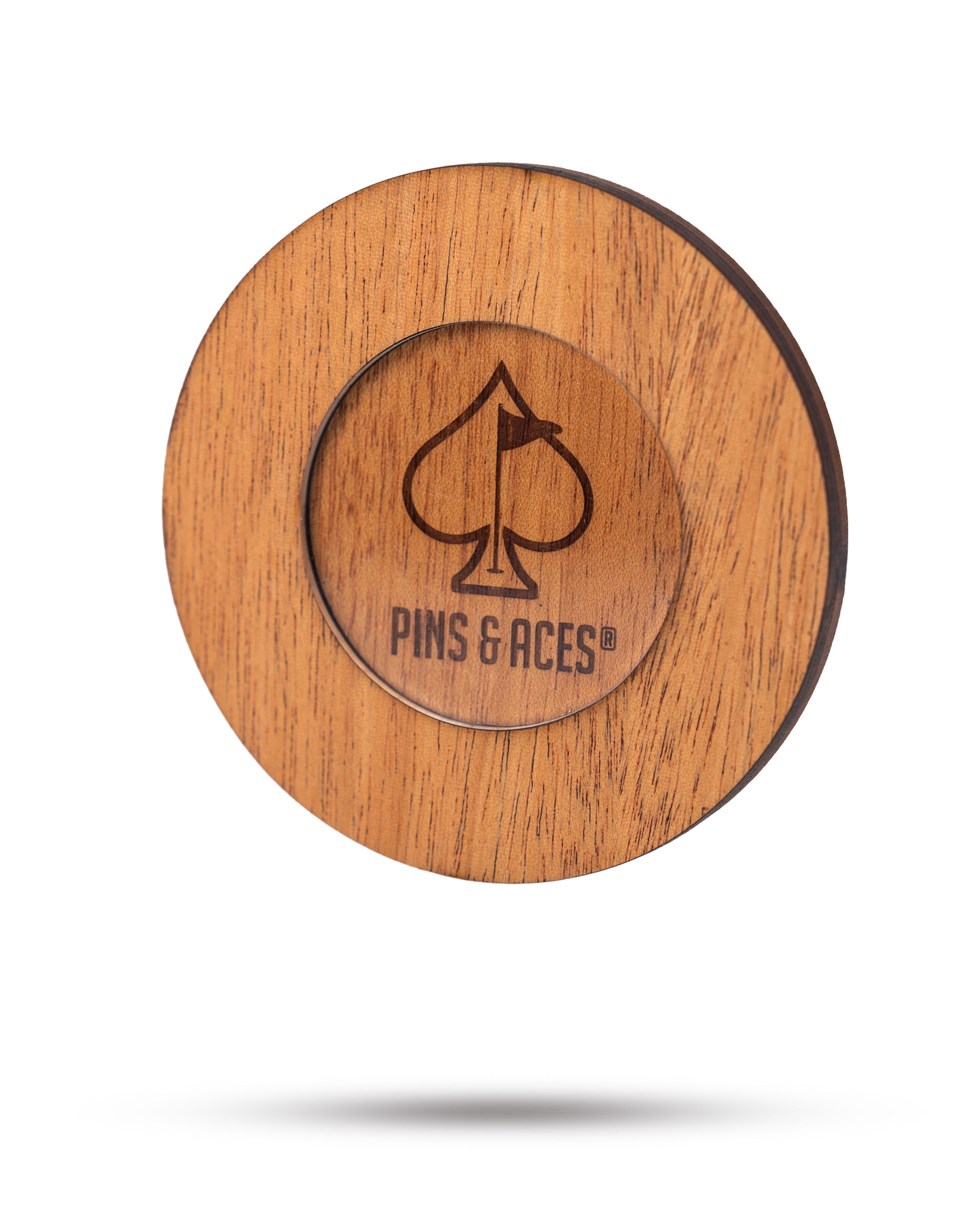 Wooden golf ball marker with PINS & ACES logo, featuring a spade symbol, for bold, standout golf accessories.