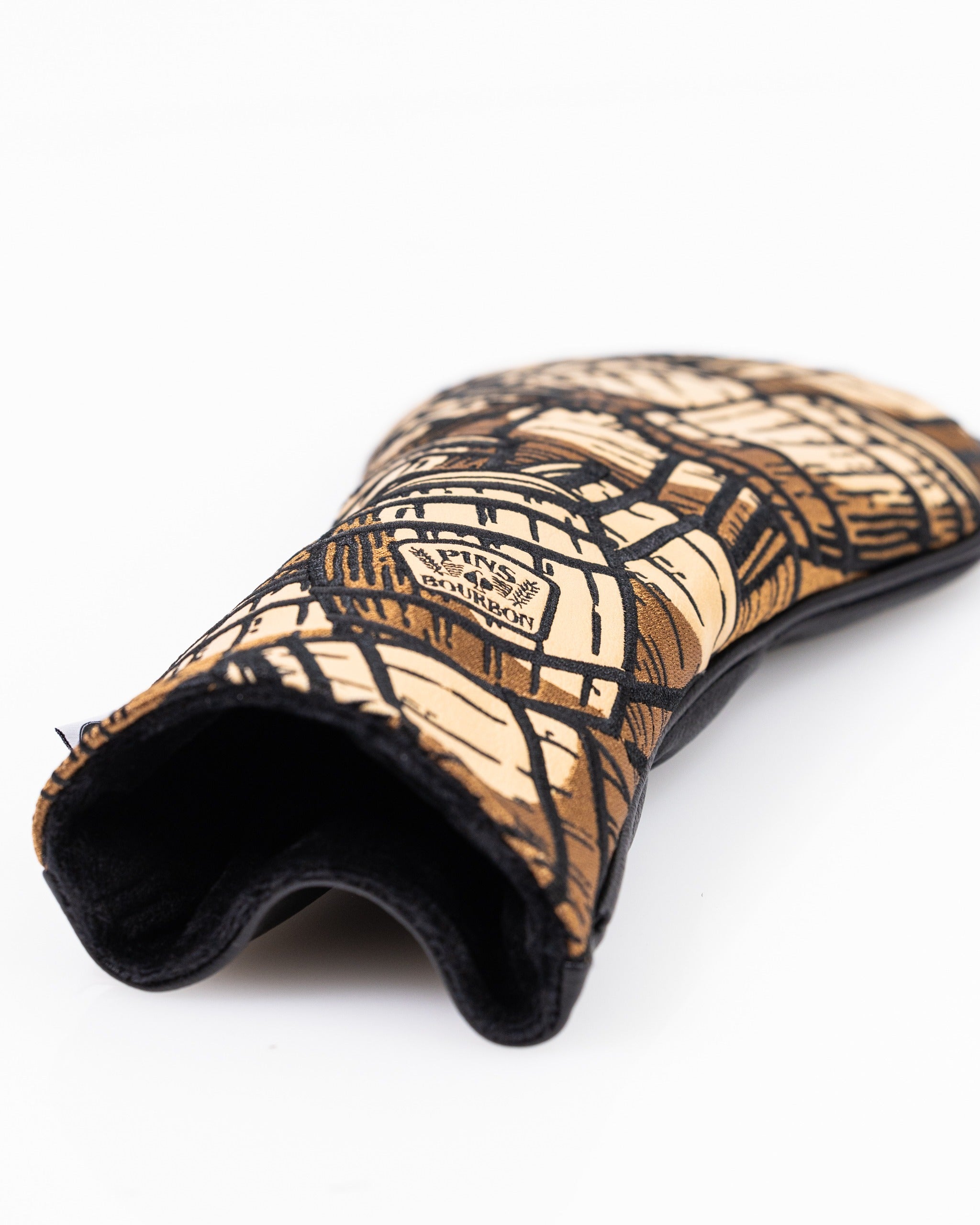 Bourbon barrel driver cover featuring a unique wood grain design, perfect for adding style to your golf bag.