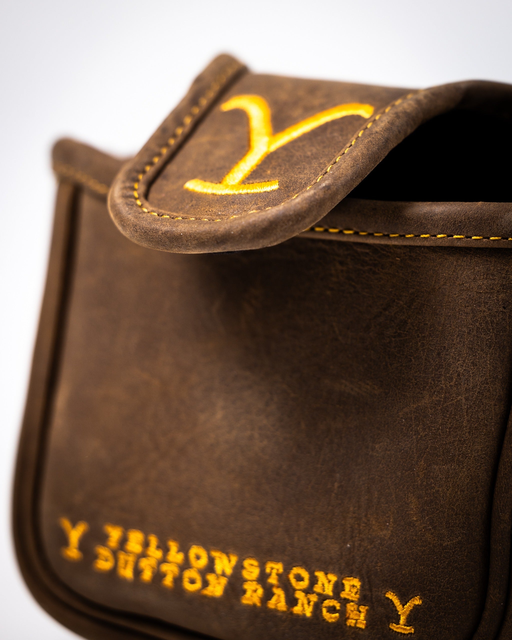 Brown mallet putter cover featuring Yellowstone Dutton Ranch logo in yellow stitching, designed for stylish golf protection.