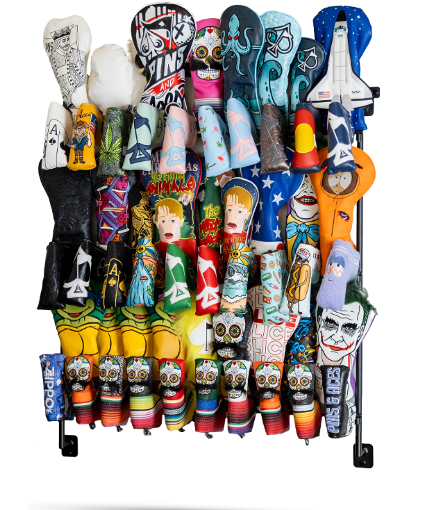 Colorful headcover rack displaying a variety of unique golf headcovers featuring bold designs and characters.