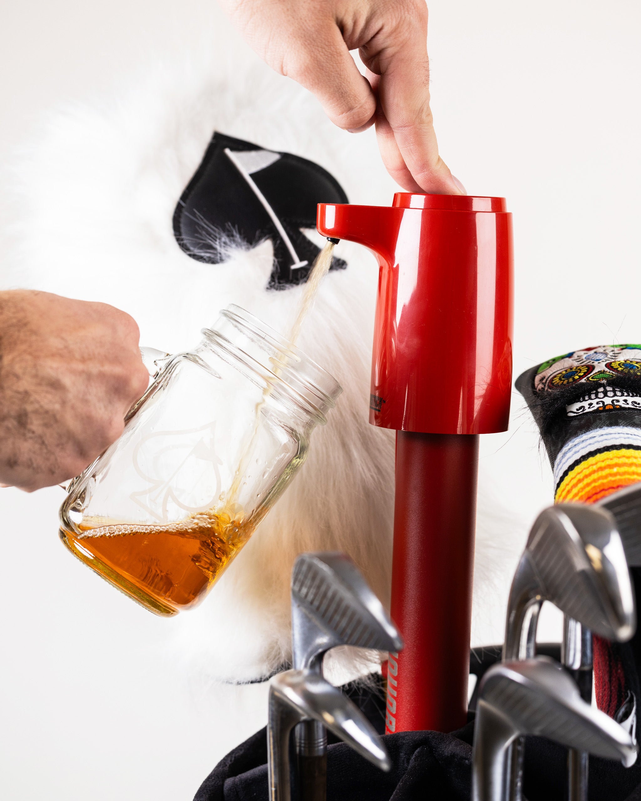 LiquorStick® 2.0 in red, featuring a sleek design with a prominent logo and modern shape, ideal for measuring and dispensing spirits.