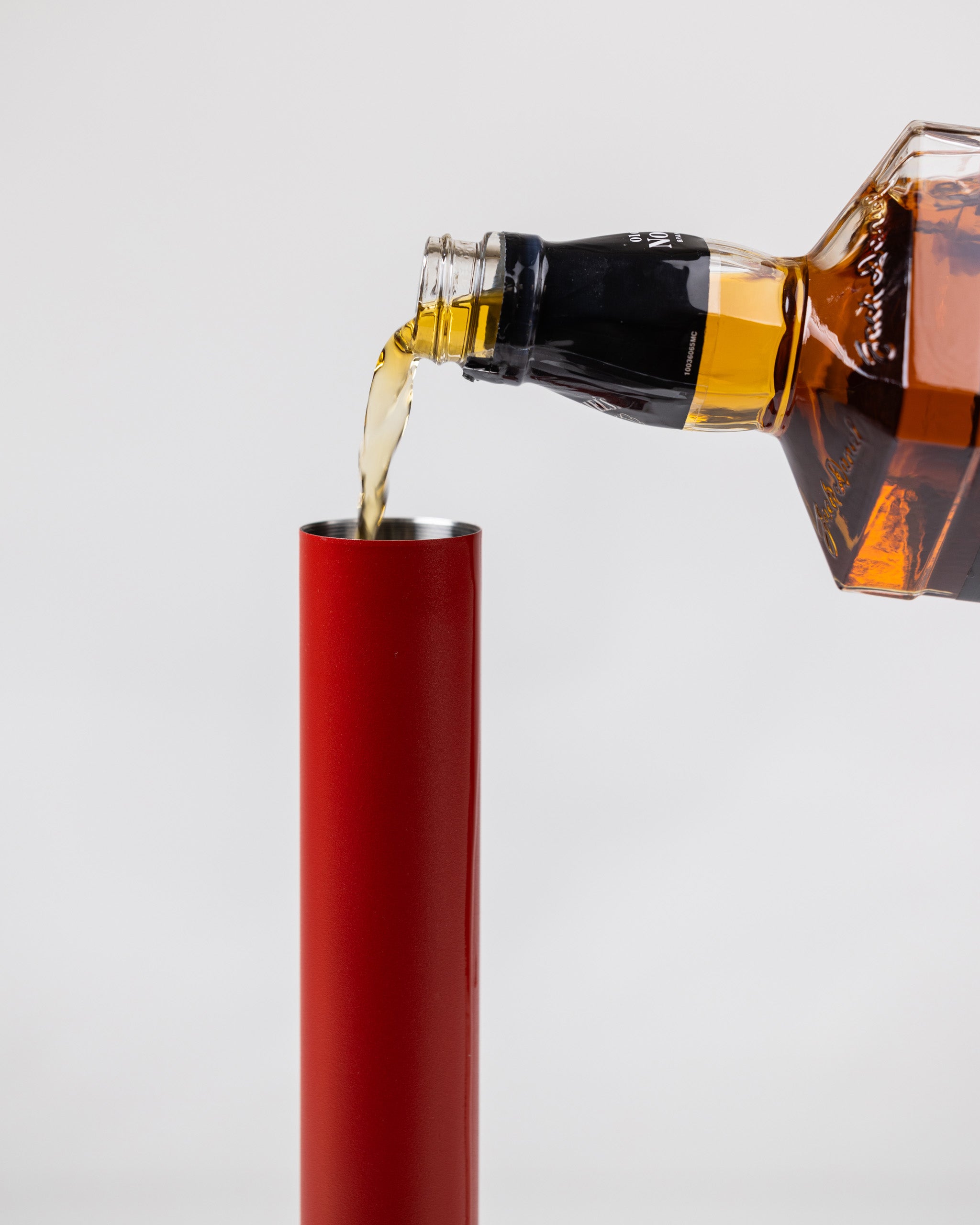 LiquorStick® 2.0 in red, featuring a sleek design and ergonomic grip, ideal for cocktail mixing and serving.