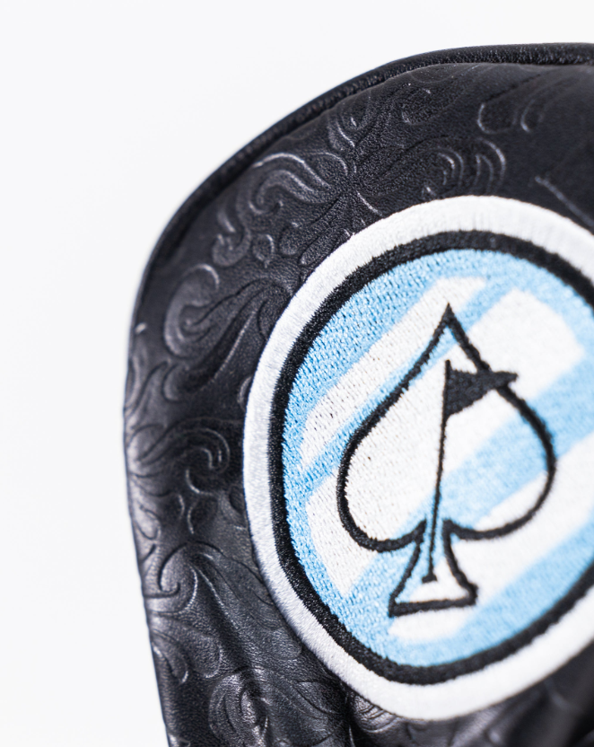 Black fairway cover featuring a stylish blue and white spade emblem, designed for golfers seeking a bold look.
