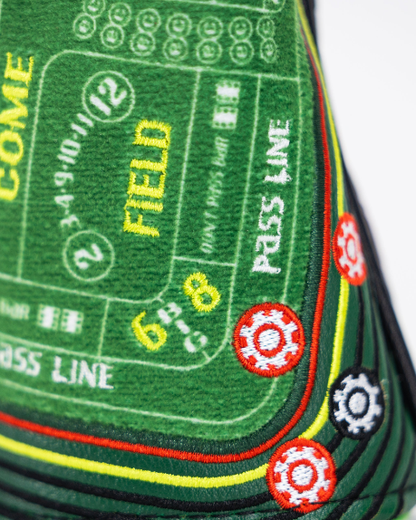 Hybrid golf headcover featuring a vibrant craps table design with colorful betting lines and game elements.