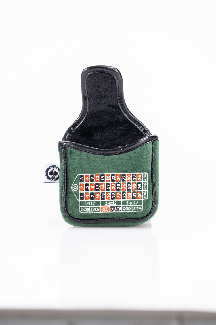 Green mallet putter cover designed like a roulette table, featuring red and black numbers for a bold golf accessory.