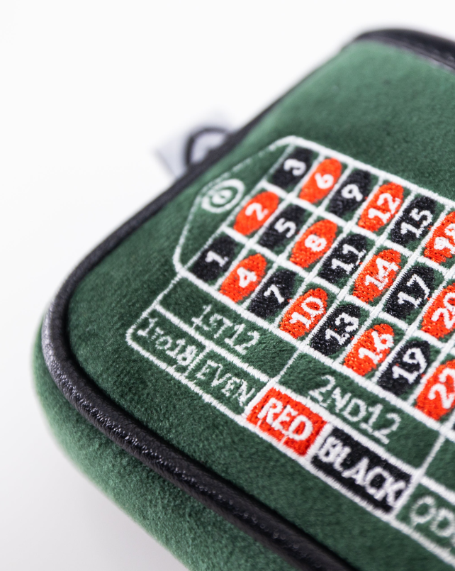 Green mallet putter cover featuring a detailed roulette design, perfect for golfers seeking a unique accessory.