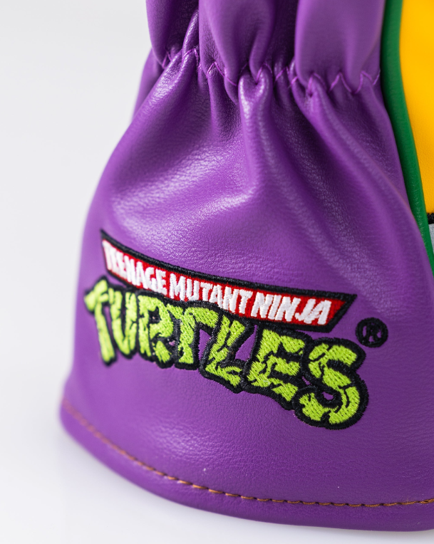 TMNT Donatello hybrid golf cover featuring vibrant purple design and embroidered logo for unique style on the course.