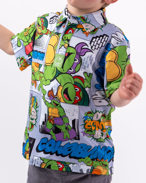 Youth shirt featuring a vibrant TMNT comic strip design with colorful characters and playful graphics, perfect for young fans.