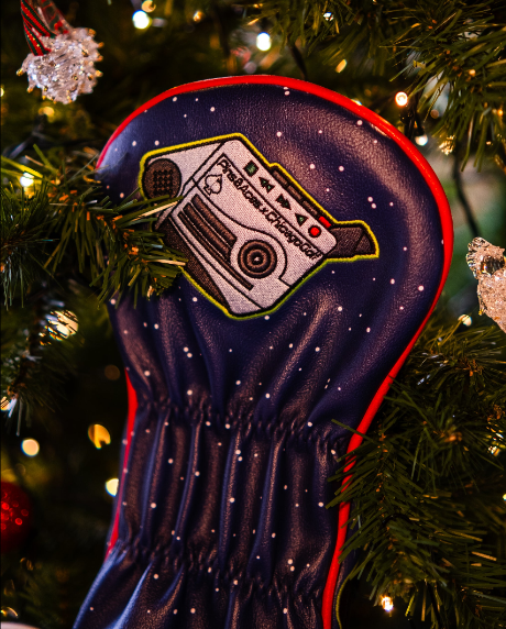 Unique Filthy Animals driver cover featuring a retro cassette player design, set against a festive holiday backdrop.