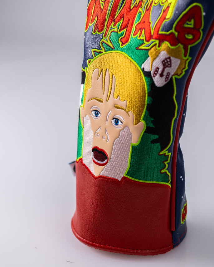 Bold driver cover featuring a colorful design with a shocked character and playful graphics, perfect for standout golf style.