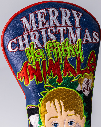 Bold driver cover featuring a festive design with "Merry Christmas" and "Ya Filthy Animals" in vibrant colors.