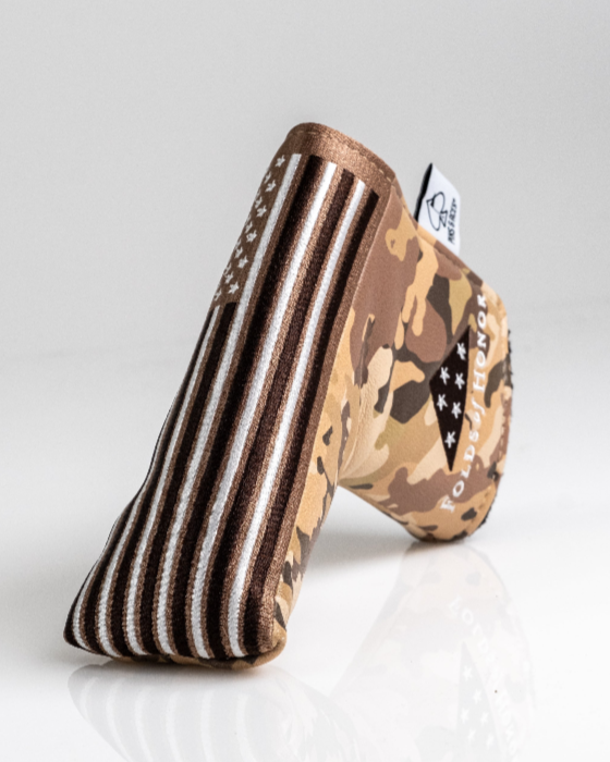 Camouflage-patterned blade putter cover with Folds of Honor branding, designed for golfers seeking unique style on the course.