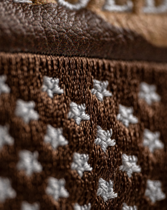 Detailed view of the Folds of Honor 2.0 mallet putter cover, showcasing intricate stitching and a rich brown texture.