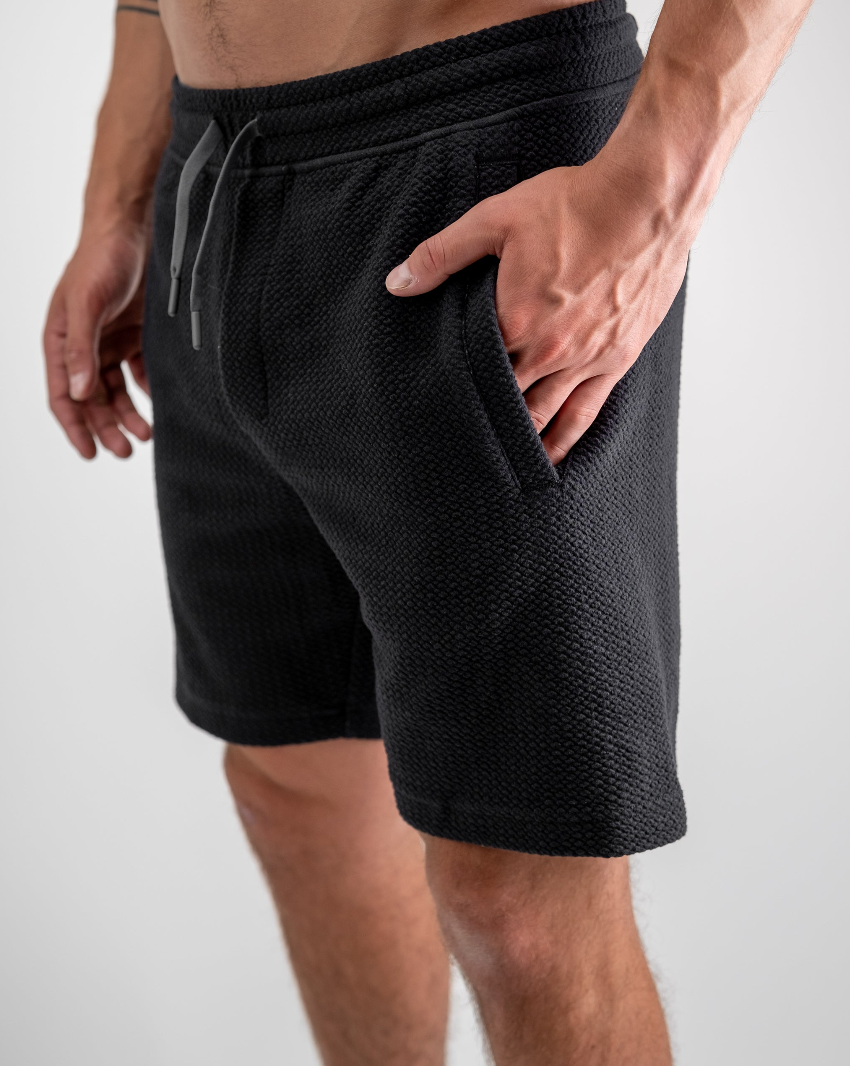Men's Player Preferred Waffleknit Shorts in Obsidian, featuring a textured fabric and side pockets for comfort and style.