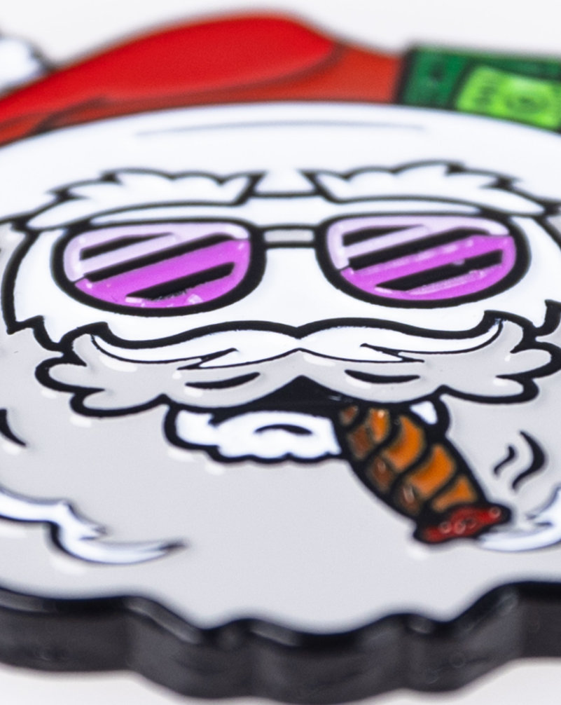 Bold ball marker featuring a playful Santa with sunglasses and a cigar, perfect for adding flair to your golf game.
