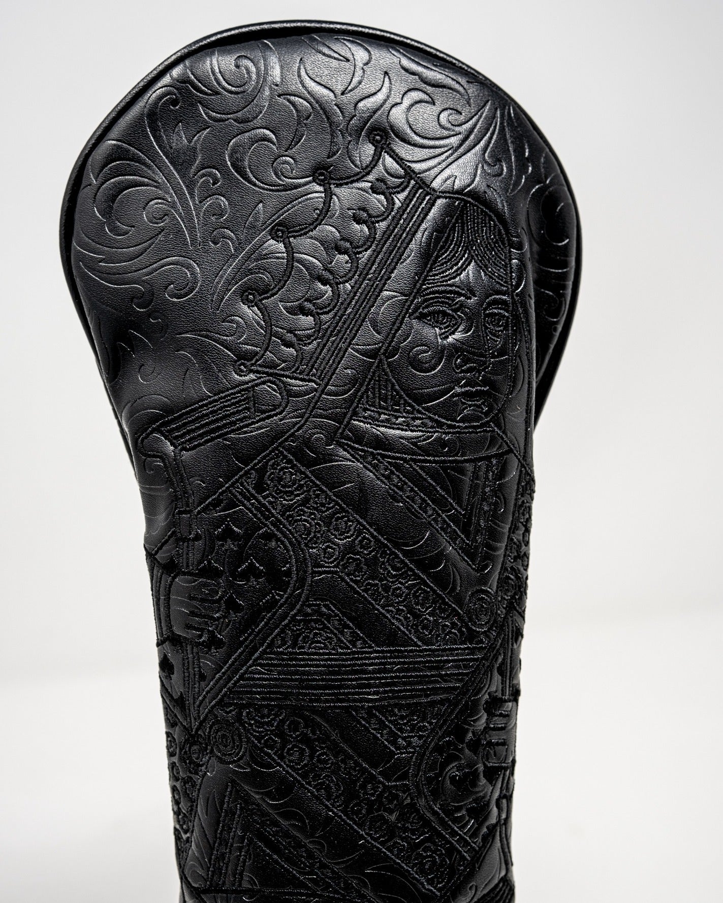 Blackout Queen of Spades fairway cover featuring intricate embossed detailing and a sleek black finish for stylish protection.